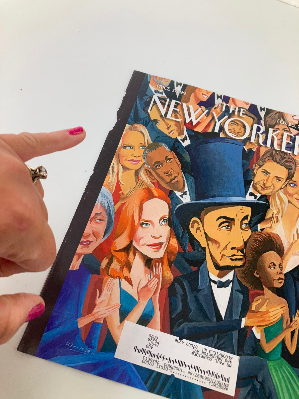 Cover of The New Yorker dated February 25, 2013, featuring an illustration of Abraham Lincoln by Mark Ulriksen, with a hand pointing towards the artwork