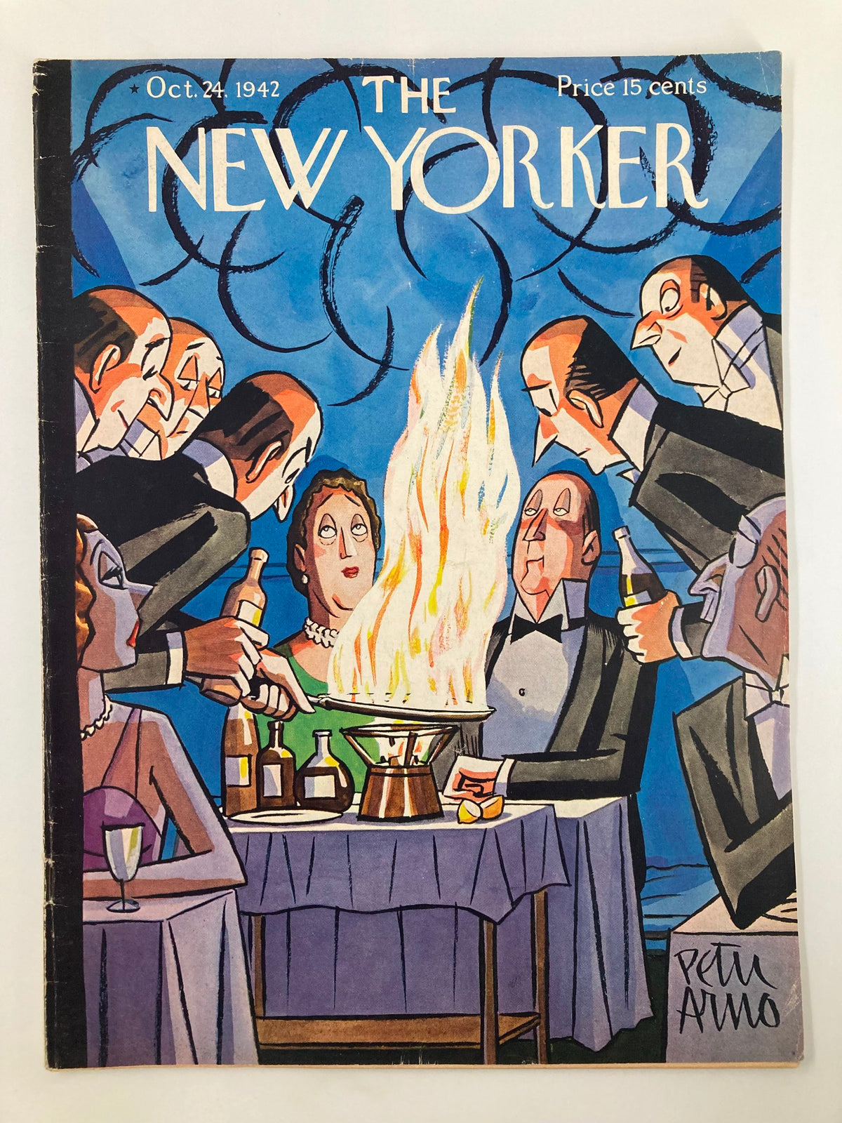 The New Yorker Magazine cover from October 24, 1942, featuring the illustration 'Couple Flame Dinner' by Peter Arno, depicting a dining scene with a flaming dish and elegantly dressed diners.