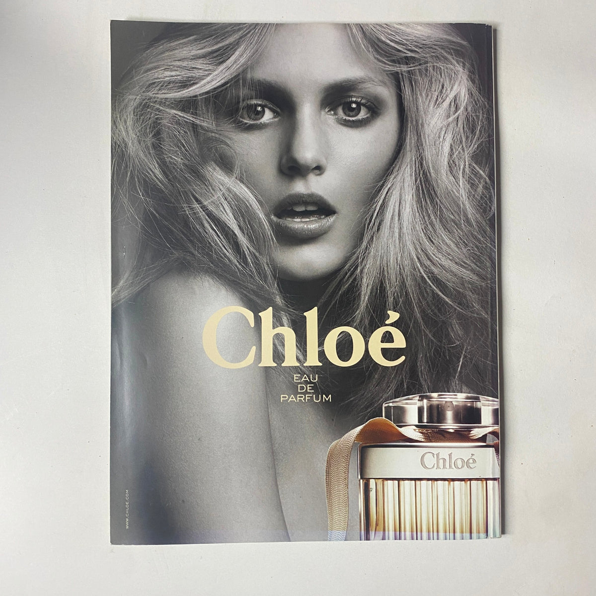 Cover of Chloe Eau de Parfum advertisement featuring a model with flowing hair, emphasizing the fragrance's elegance, as part of the content explored in Harper's Bazaar UK Magazine February 2010 with Julianne Moore on the cover.