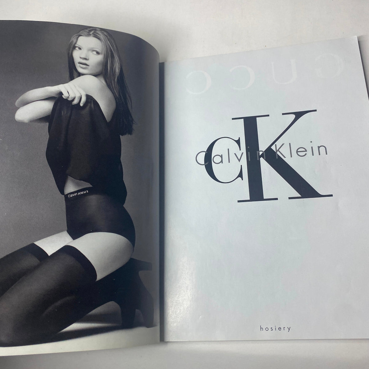 Harper's Bazaar Magazine February 1993 featuring a Calvin Klein hosiery advertisement, showcasing a model in black apparel and stockings.