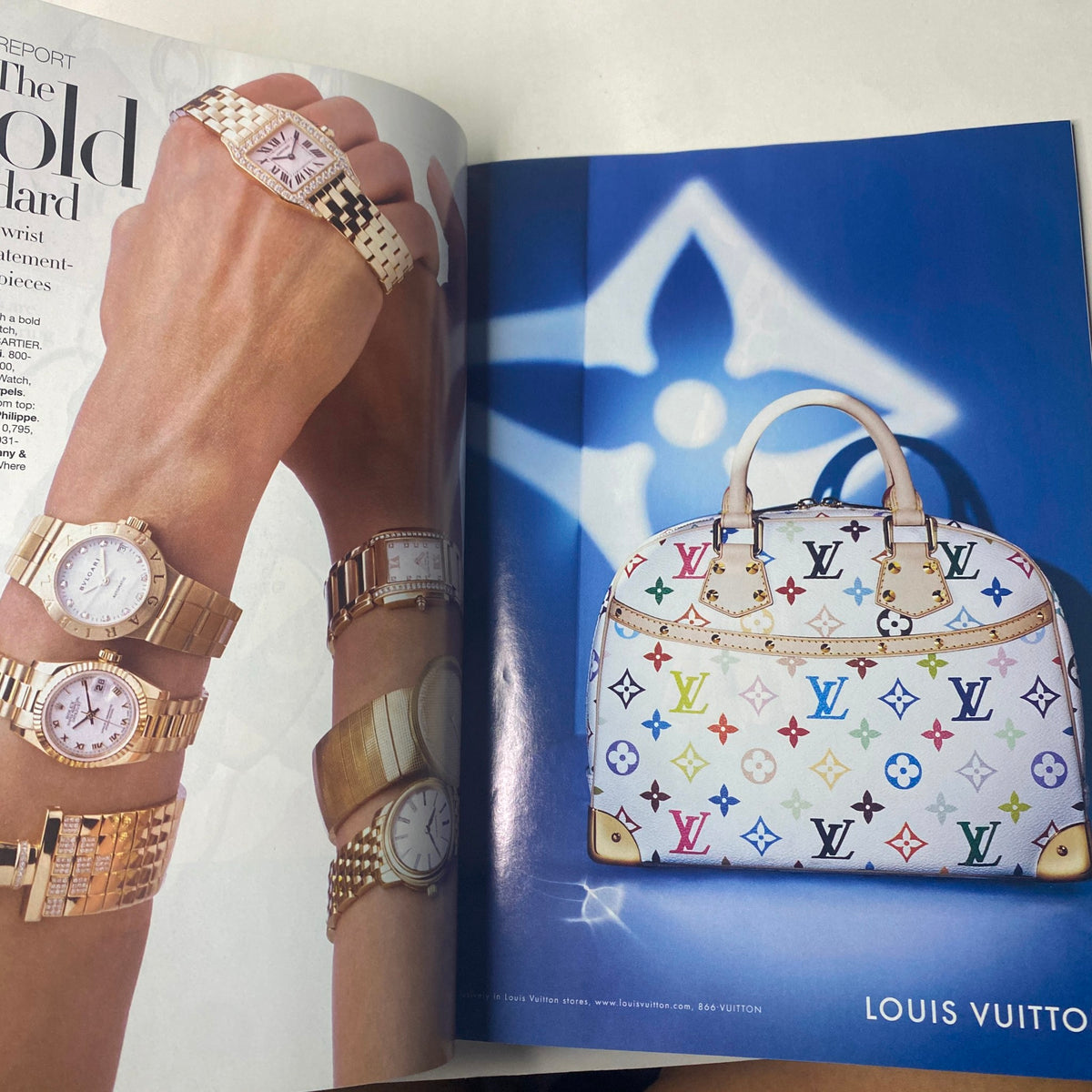 Louis Vuitton luxury handbag and elegant watches showcased in a sophisticated advertisement, featured in Harper's Bazaar Magazine January 2005 Scarlett Johansson Cover.