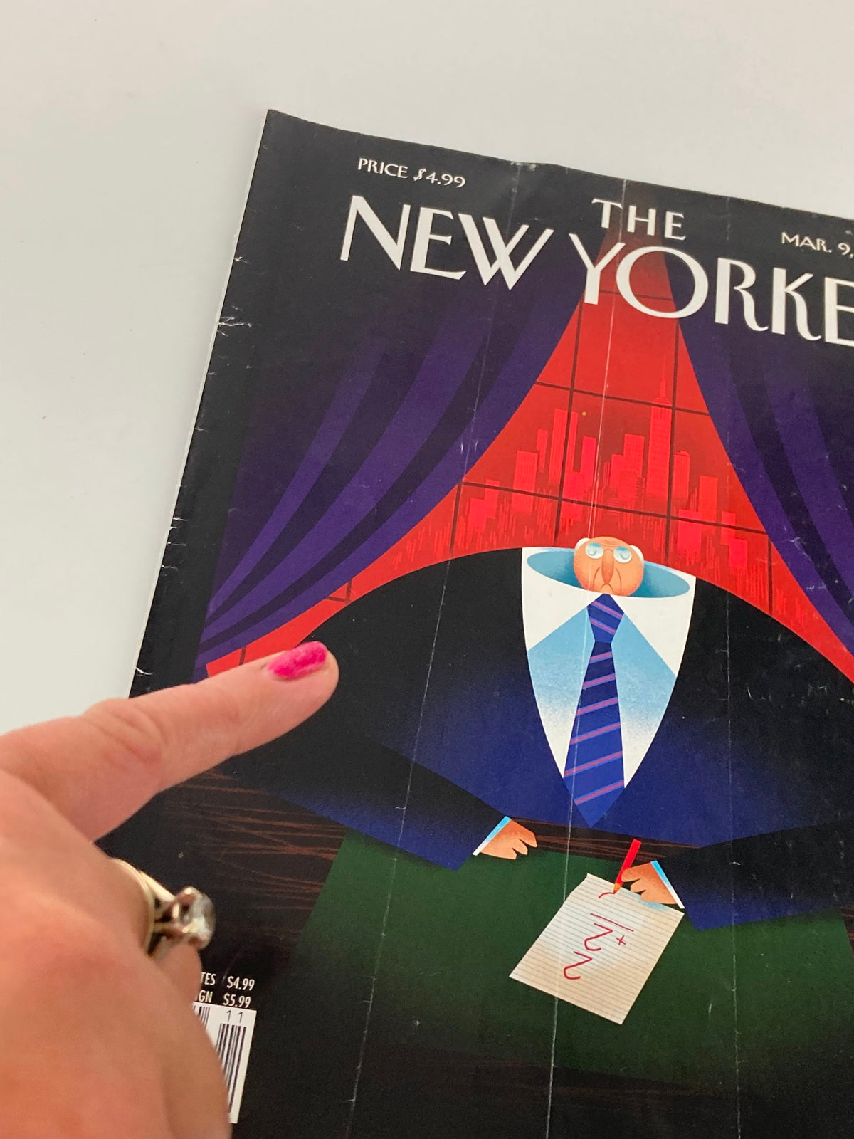 COVER ONLY The New Yorker March 9 2009 Theme Cover downsized by Bob Staake, highlighting a hand pointing at the cover design with visible creases and artistic elements.