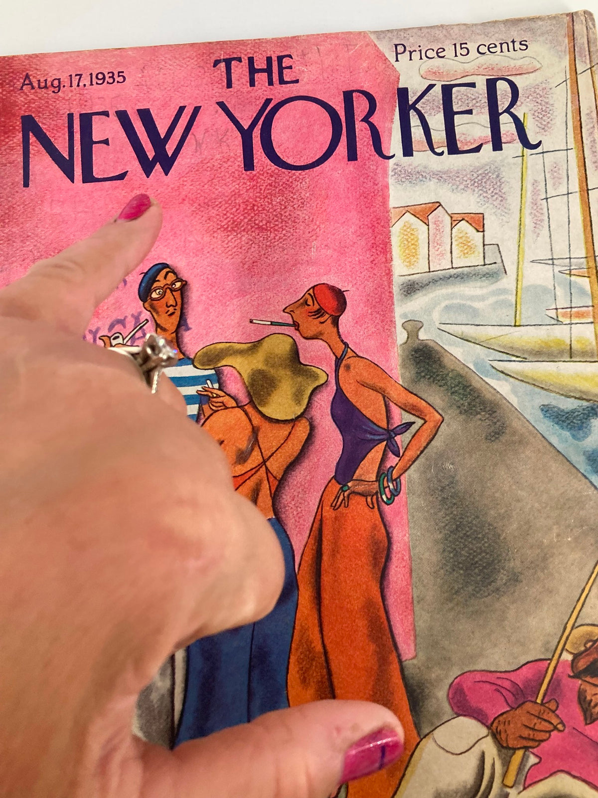 Close-up of the cover of The New Yorker Magazine August 17, 1935, highlighting the title and artwork "Smoke Break" by Julian de Miskey with a finger pointing at the details.