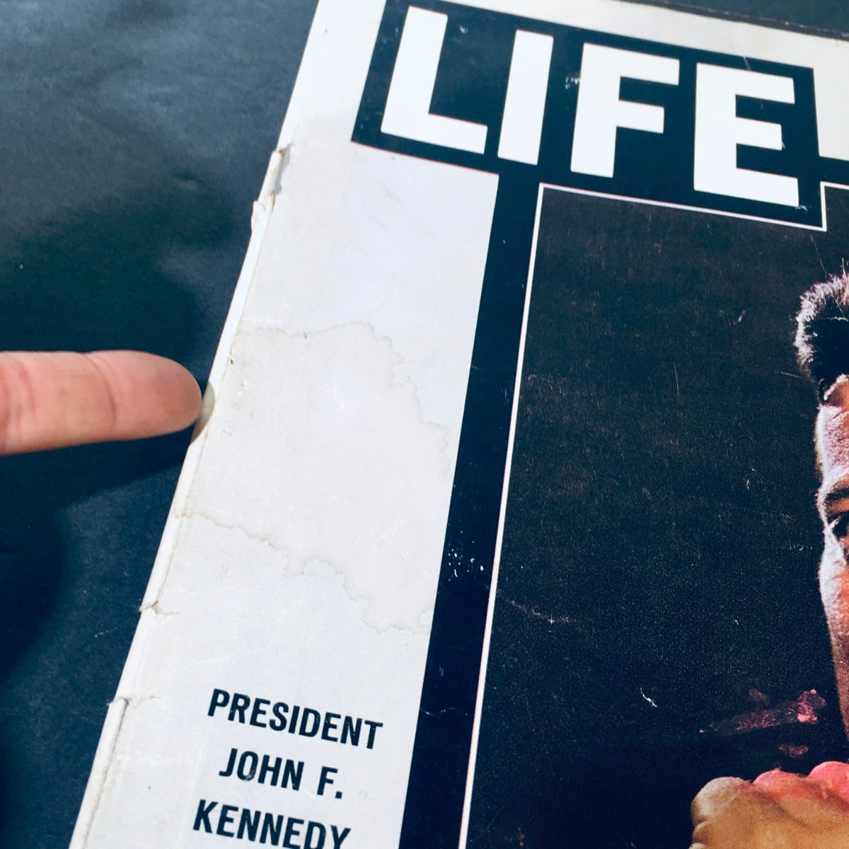 Close-up of the spine of the VTG Life Magazine November 29, 1963, demonstrating age-related wear and preservation details.