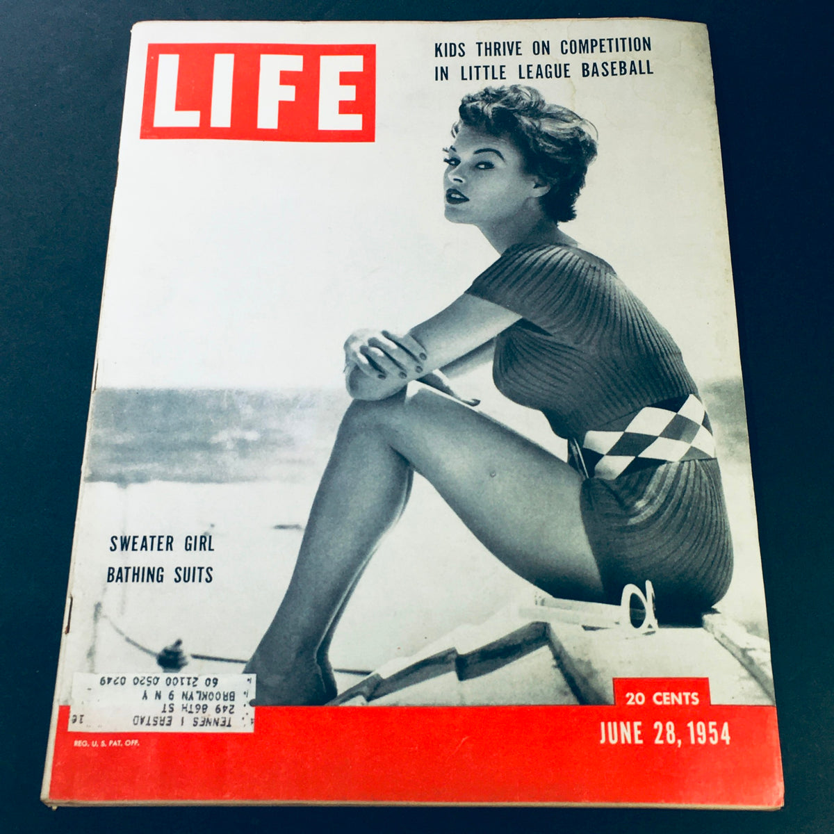 VTG Life Magazine June 28 1954 cover featuring Sweater Girl bathing suits and a model by the beach, highlighting the charm of 1950s fashion and youth sports.