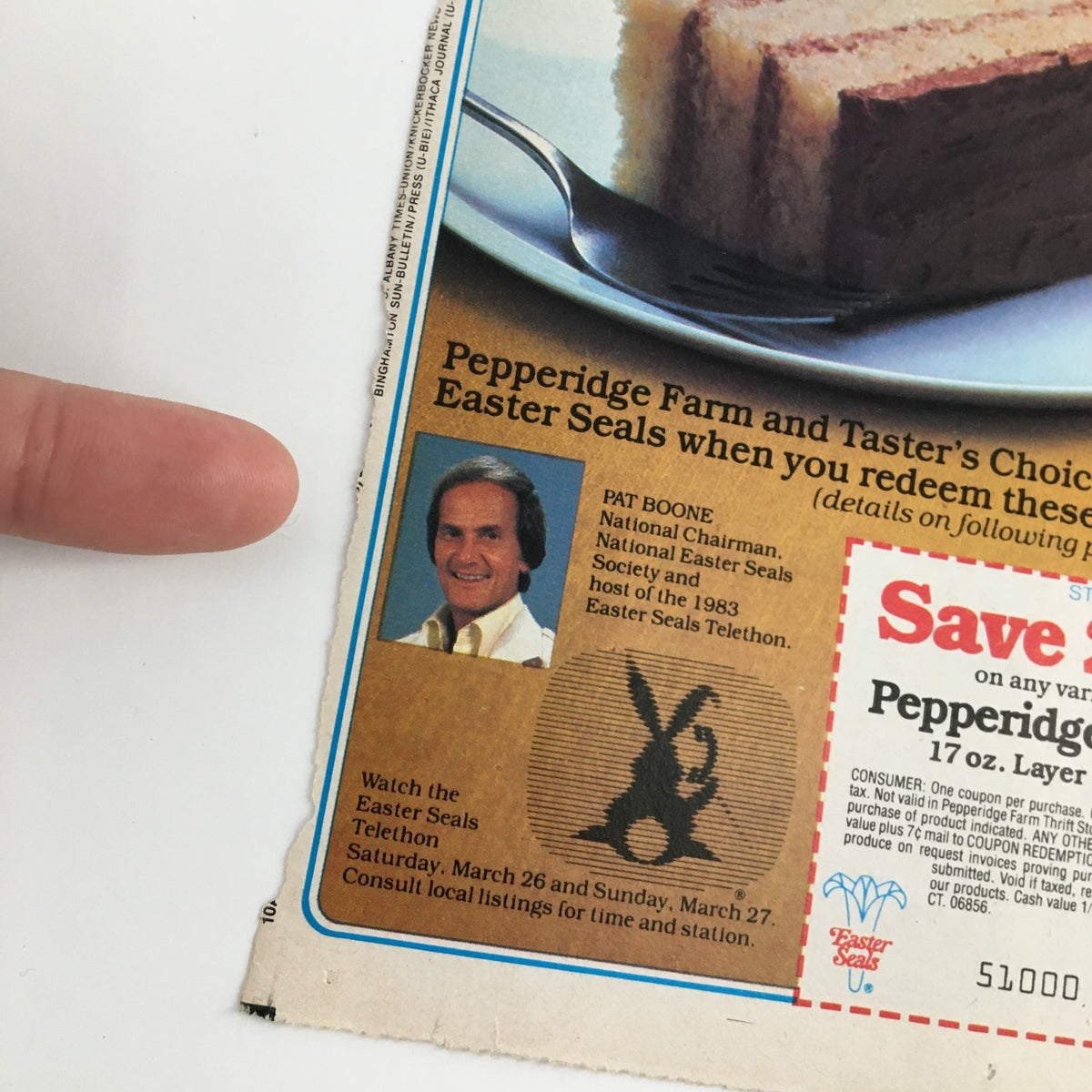 Detail from the 1983 Pepperidge Farm Golden Cake & Folger's Coffee Coupon featuring a photo of Pat Boone and Easter Seals promotion alongside savings details.