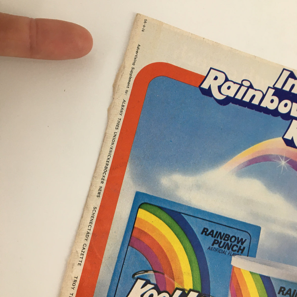 Close-up of the 1984 Kool-Aid Rainbow Punch Circular Coupon Advertisement highlighting the Rainbow Punch packaging and promotional design, emphasizing the fun branding of Kool-Aid.