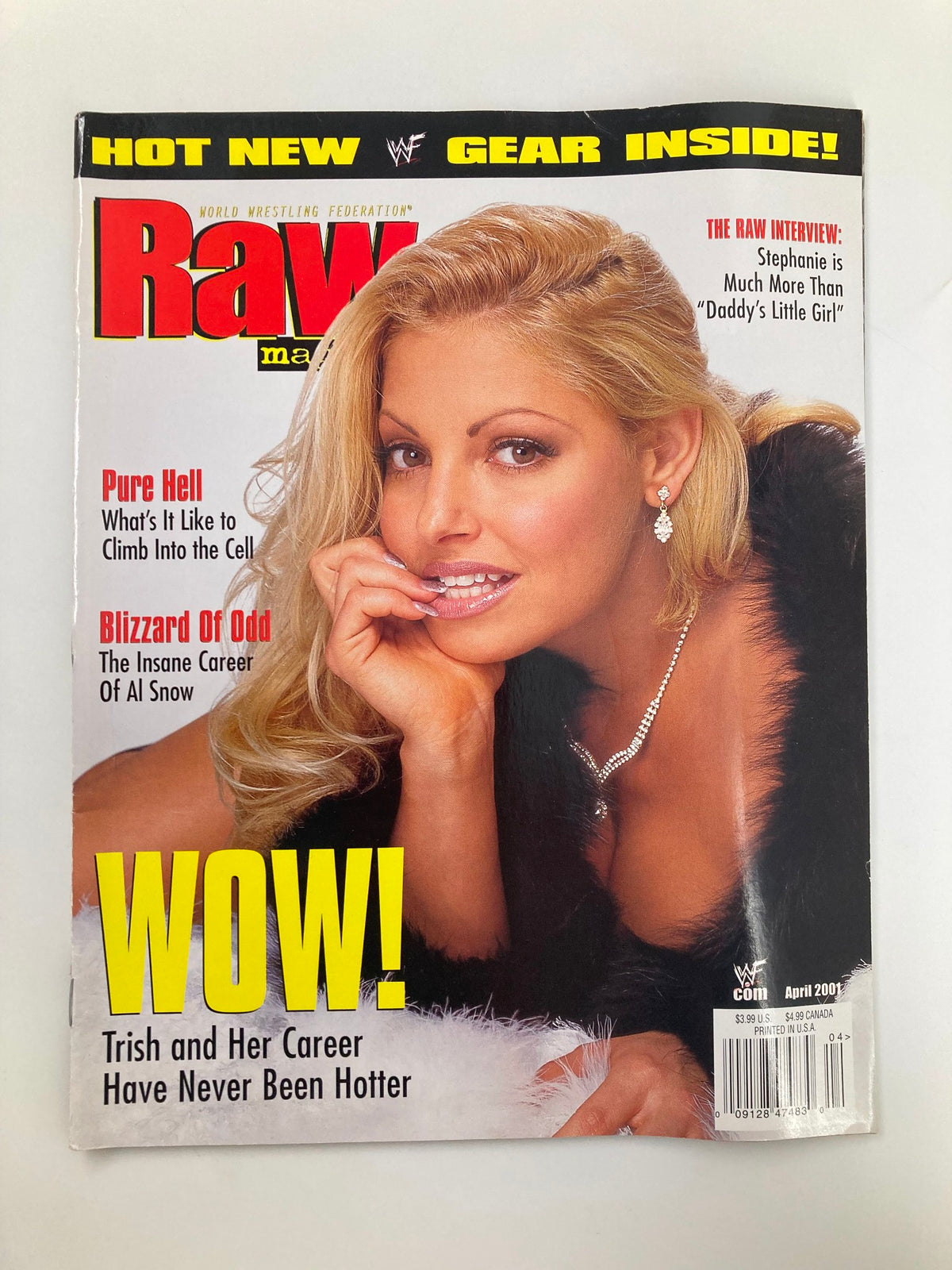 WWF Raw Magazine April 2001 featuring Trish Stratus on the cover, showcasing her iconic look and emphasizing her never hotter career.