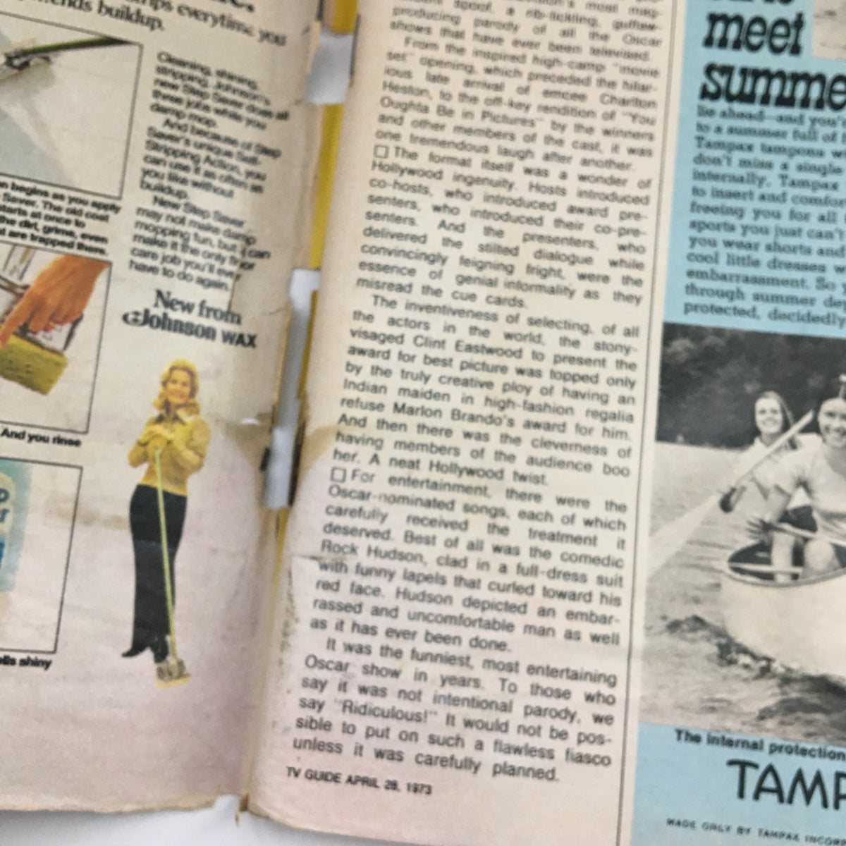 Vintage magazine page from TV Guide Magazine April 28 1973, showcasing advertisements and an article about the Oscars, featuring humorous insights into the 1973 entertainment landscape related to The Waltons.