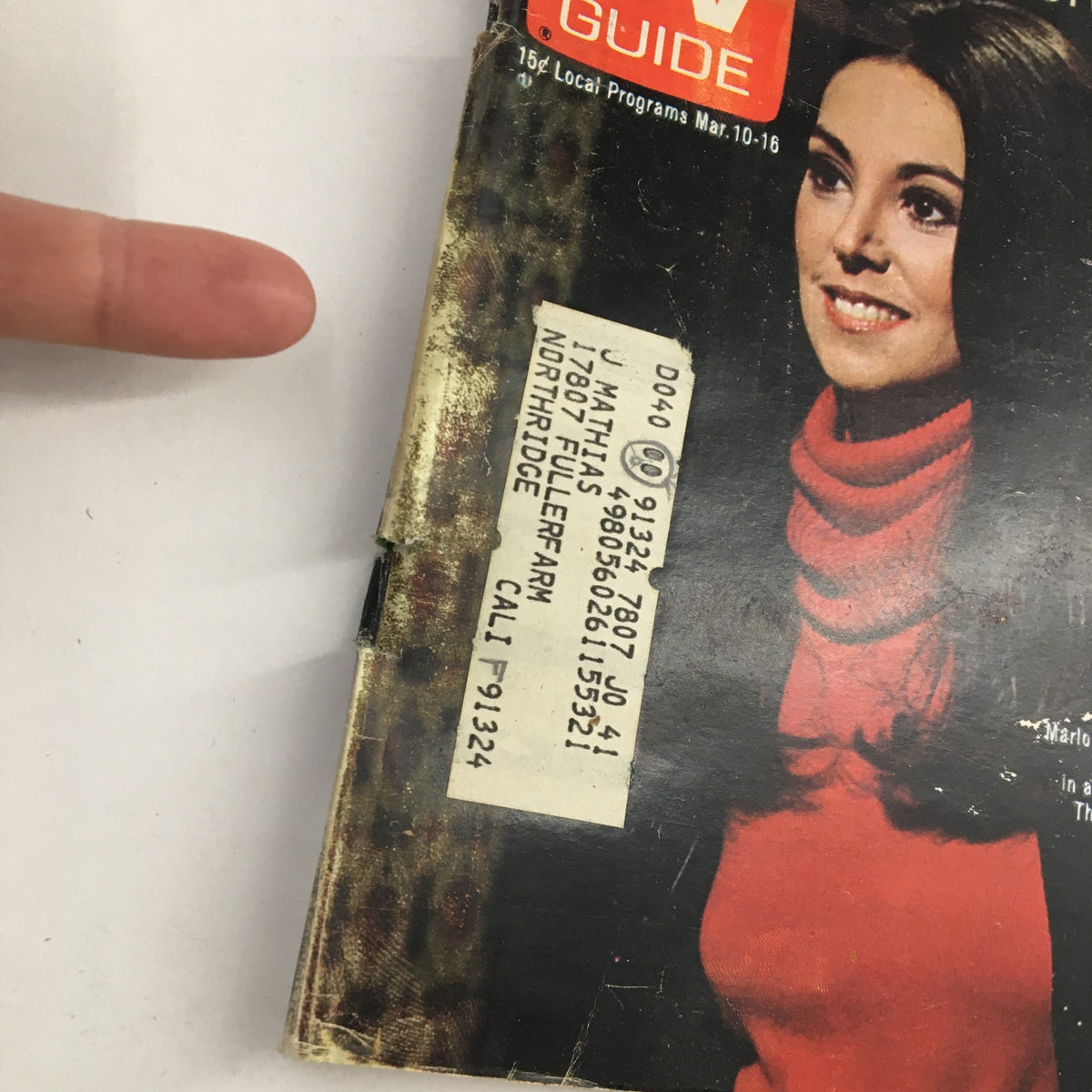 Close-up of TV Guide Magazine March 10, 1973, showing Marlo Thomas on the cover and an address label, highlighting its vintage details.