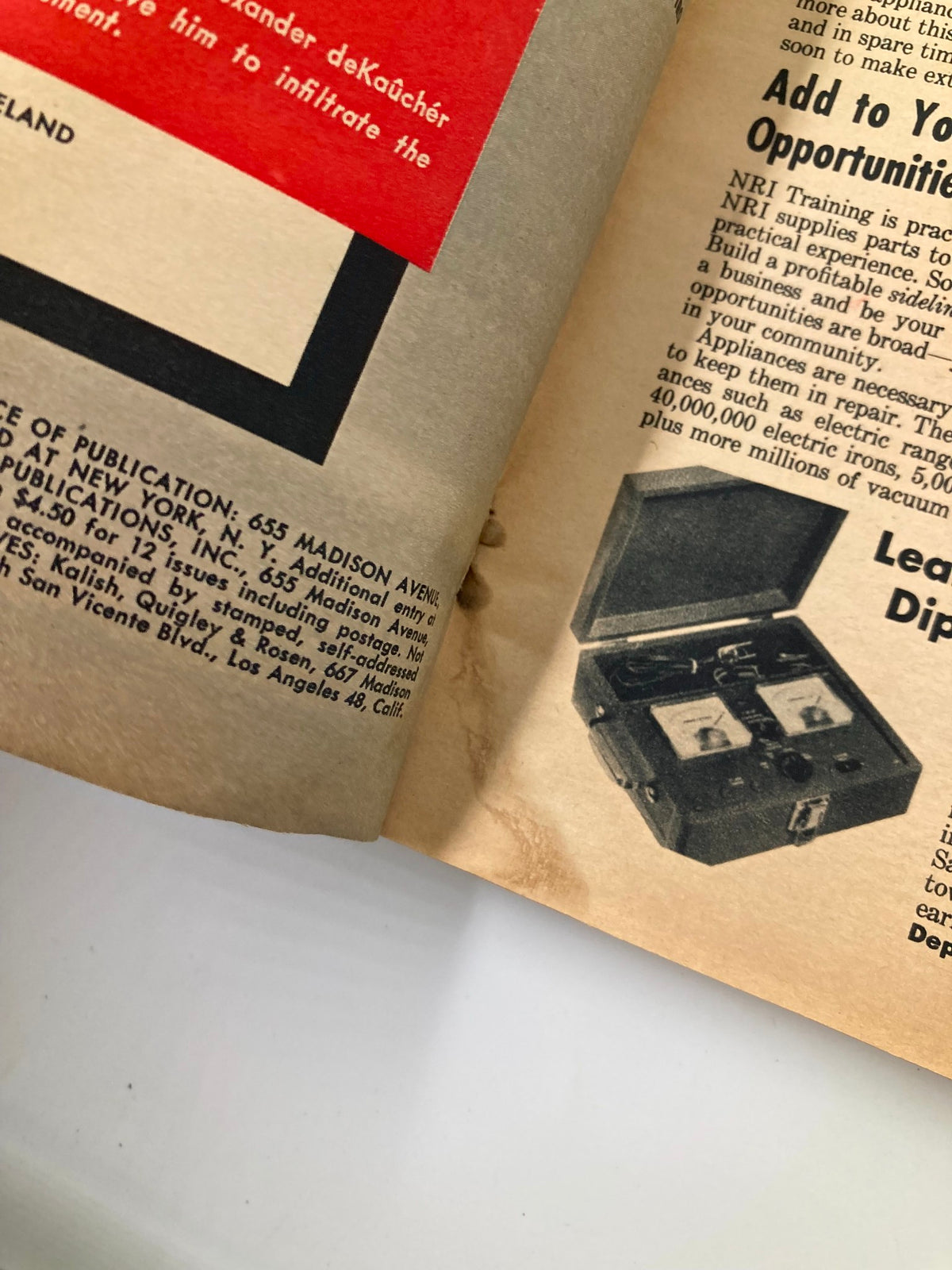 Interior page of VTG Man's World Magazine October 1959 displaying advertisements and the 'True Book Bonus: The Fraulein Sellout' section.
