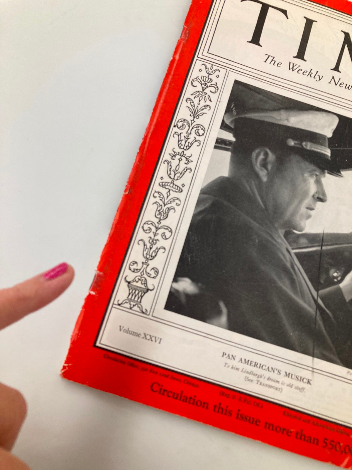 Close-up of the cover of VTG Time Magazine December 2, 1935, Vol 26 #23 highlighting Pan American's Edwin Charles Musick with finger pointing at a detail on the magazine.