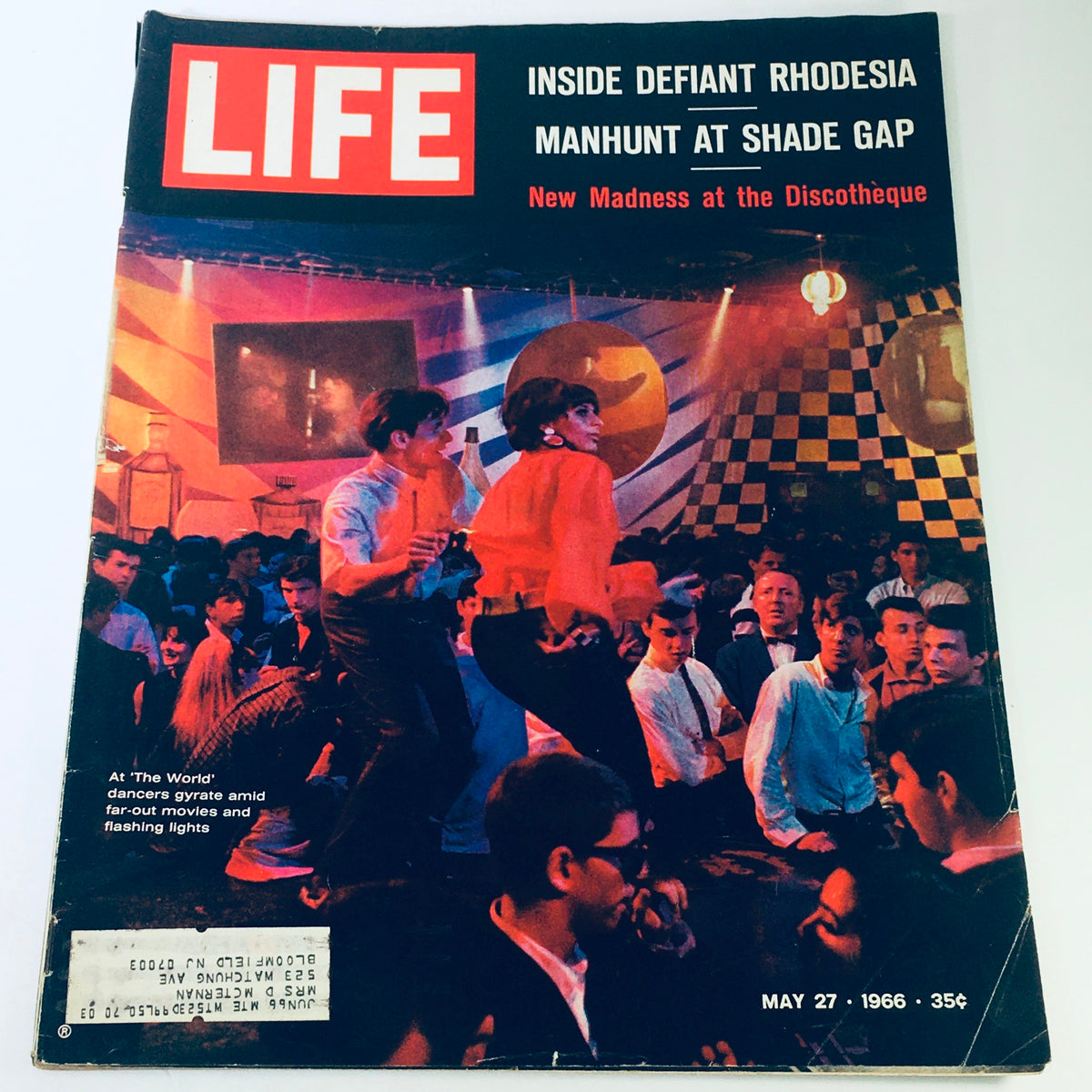 Cover of the vintage Life Magazine from May 27, 1966, titled 'Inside Defiant Rhodesia / Madness at Discotheque', featuring vibrant imagery of people dancing at a discotheque, capturing the cultural essence of the 1960s.