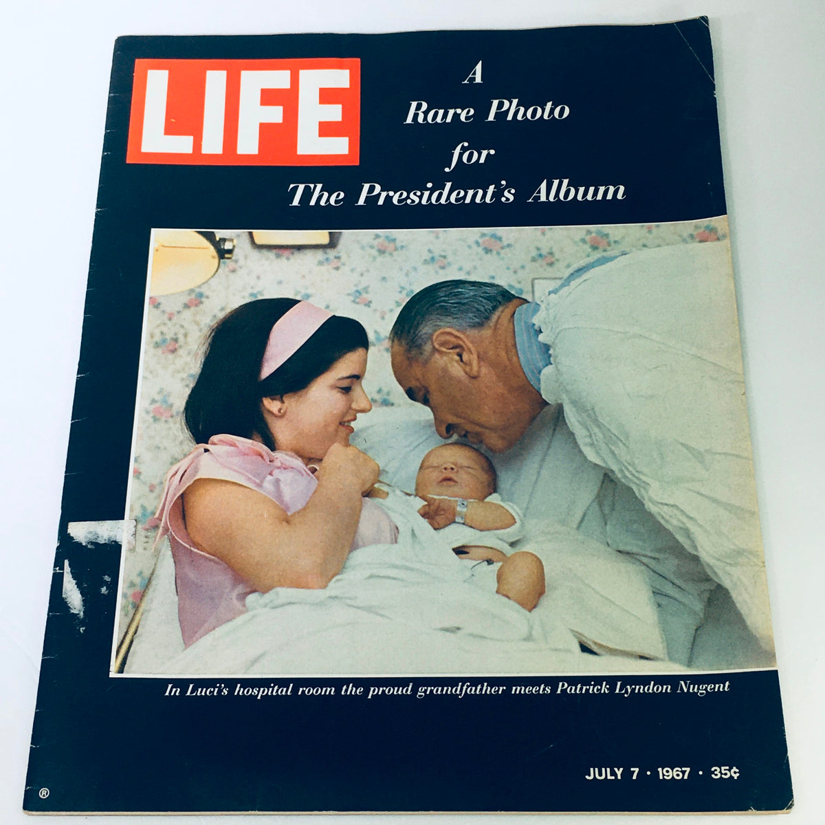 Front cover of VTG Life Magazine July 7, 1967 featuring Lyndon Johnson with how a baby and mother, representing a significant historical moment.