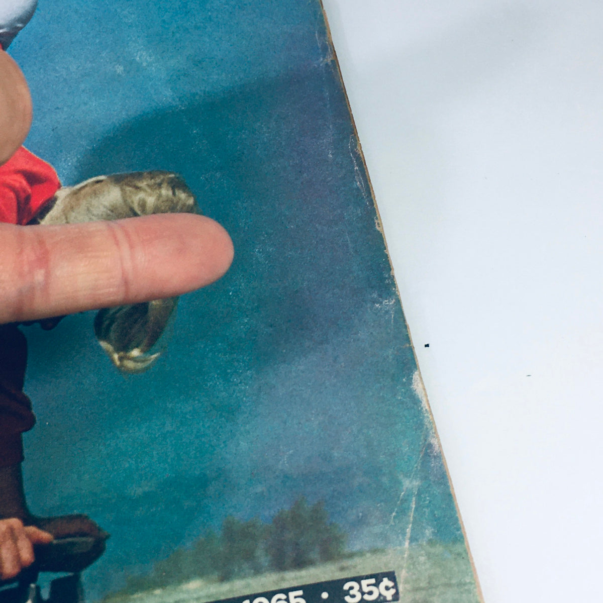 Close-up view of the cover of VTG Life Magazine May 14, 1965. The magazine features a girl doing a handstand on a skateboard, representing the growing skateboarding trend in the 1960s.