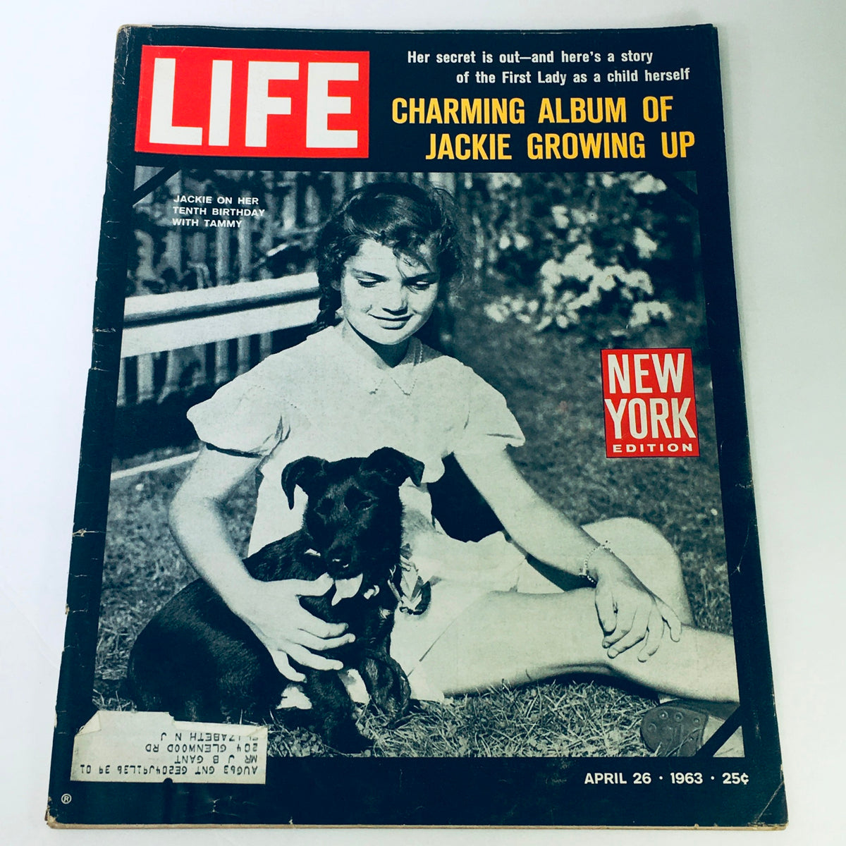 Vintage Life Magazine cover from April 23, 1963, featuring a charming album of Jackie Kennedy growing up, showcasing historical photography of Jackie Kennedy as a child with her dog.