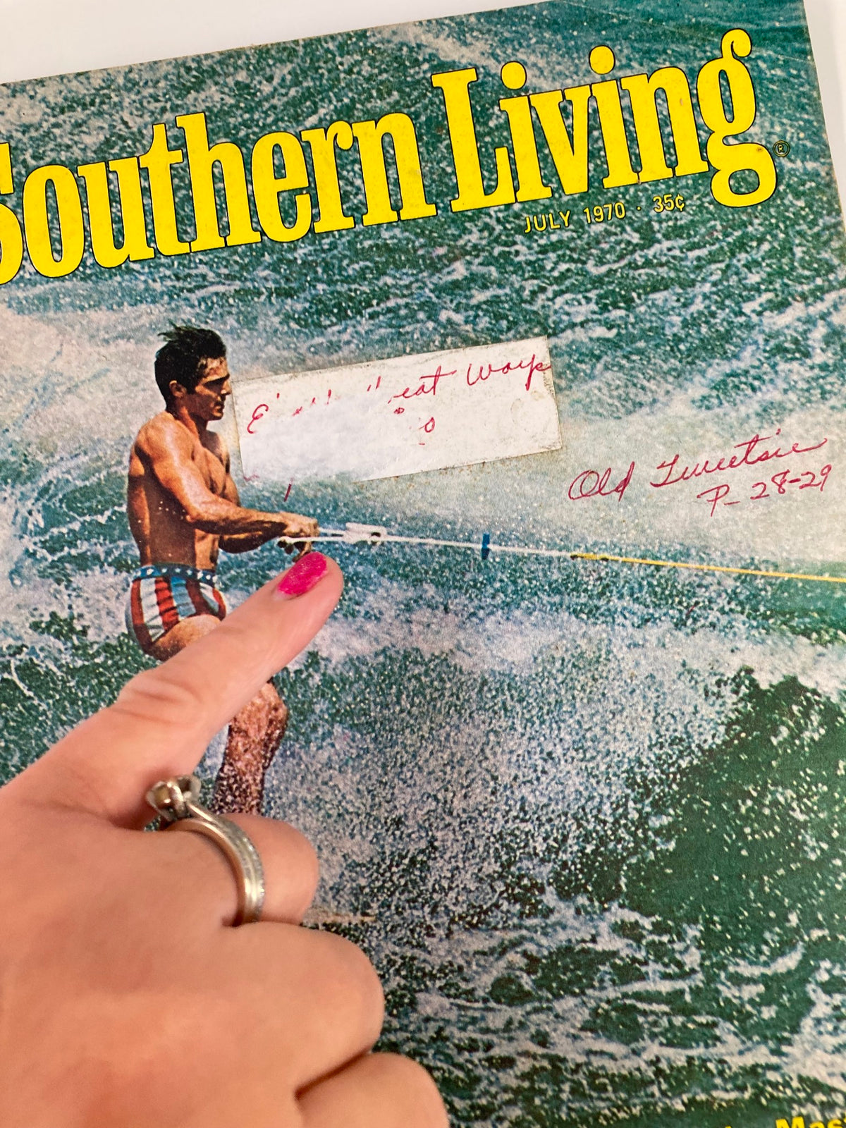 Close-up of the July 1970 Southern Living Magazine cover, highlighting the text 'Champions in the Wake of the Masters' and a man's hand pointing at the magazine.