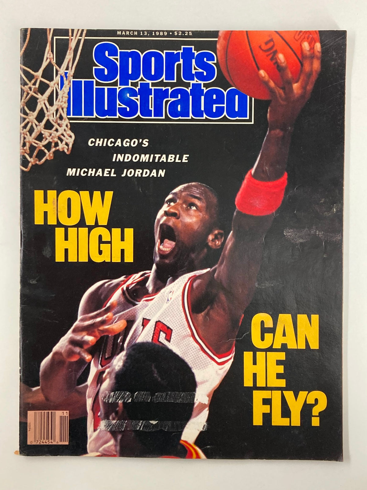 Sports Illustrated Magazine March 13 1989 featuring Chicago's Indomitable Michael Jordan on the cover with a basketball, highlighting the question 'How High Can He Fly?'. Vintage sports memorabilia showcasing Michael Jordan's early career.