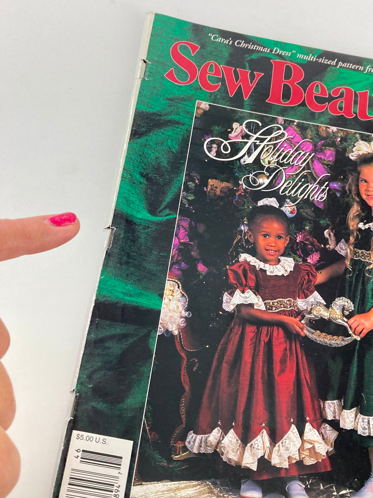 Close-up of the Sew Beautiful Magazine September 1994 cover highlighting Cara's Holiday Dress, with a focus on the childrens' outfits and decorations.