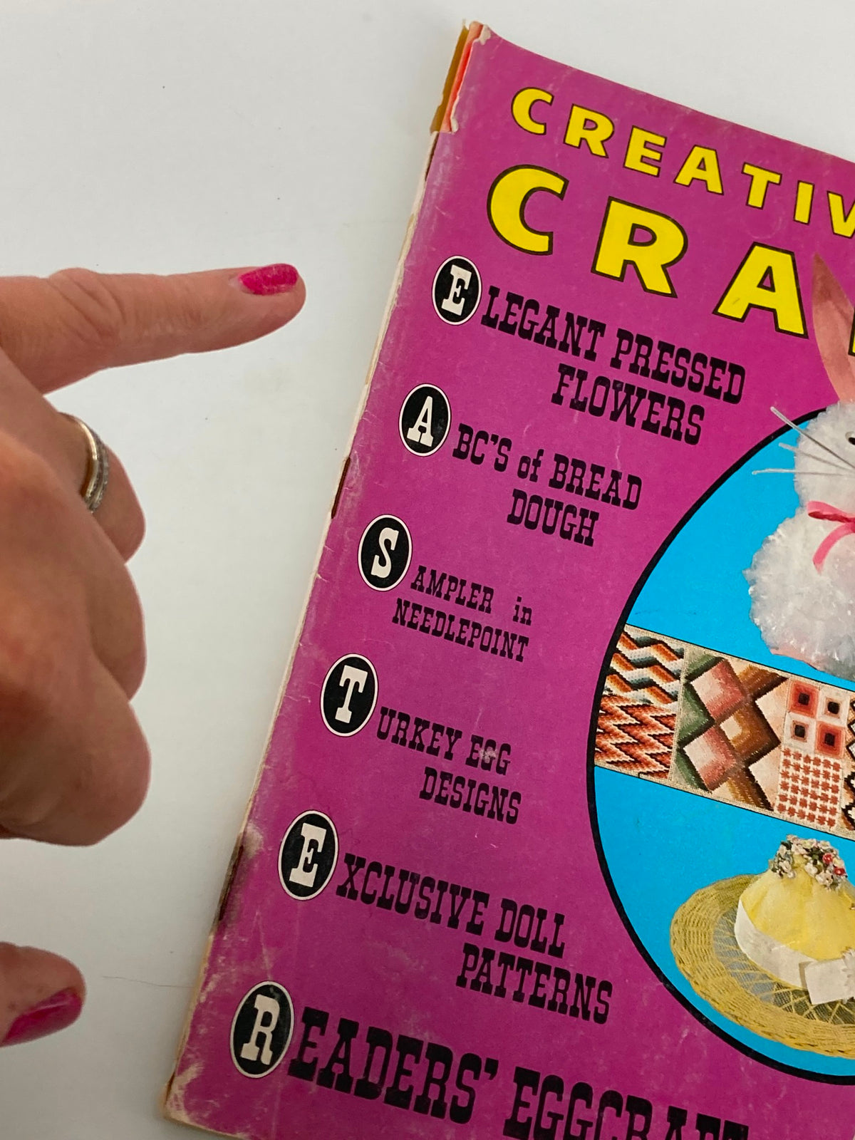 Close-up of the cover of VTG Creative Crafts Magazine April 1973 showing the title and key craft projects like Easter Bonnets and Egg Designs.