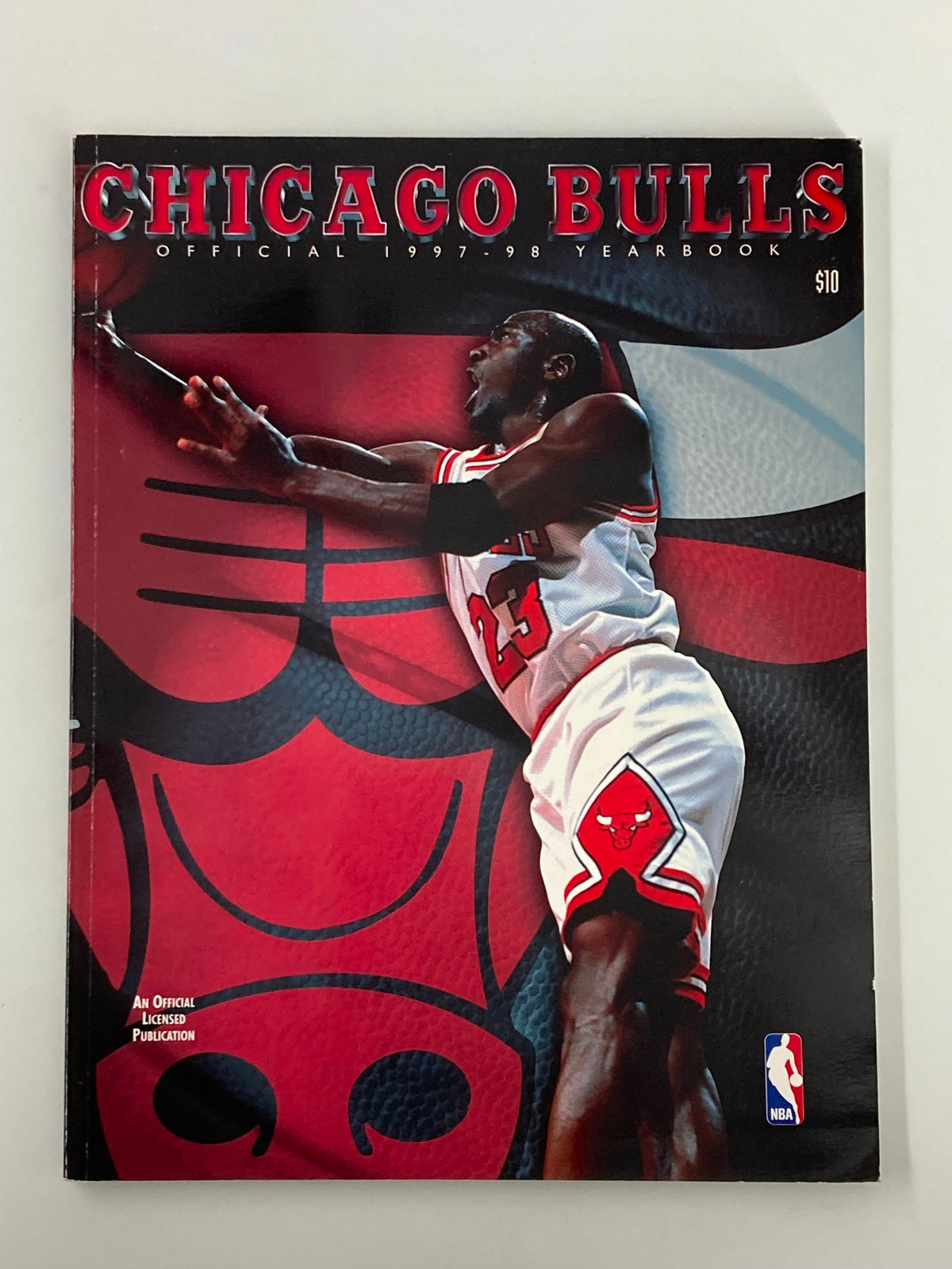 NBA Chicago Bulls Official 1997 - 1998 Yearbook cover featuring Michael Jordan in action, showcasing the iconic design and historical significance of this vintage magazine.