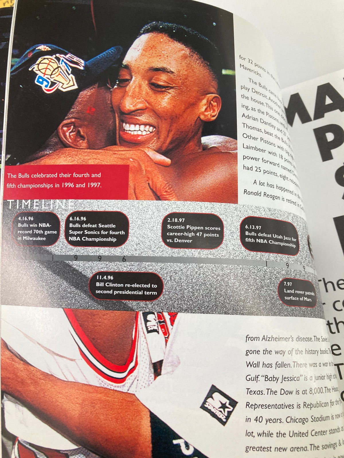 Emotional moment between Chicago Bulls players celebrating their fourth and fifth championships in the 1997 NBA season, featured in the NBA Chicago Bulls Official 1997 - 1998 Yearbook.