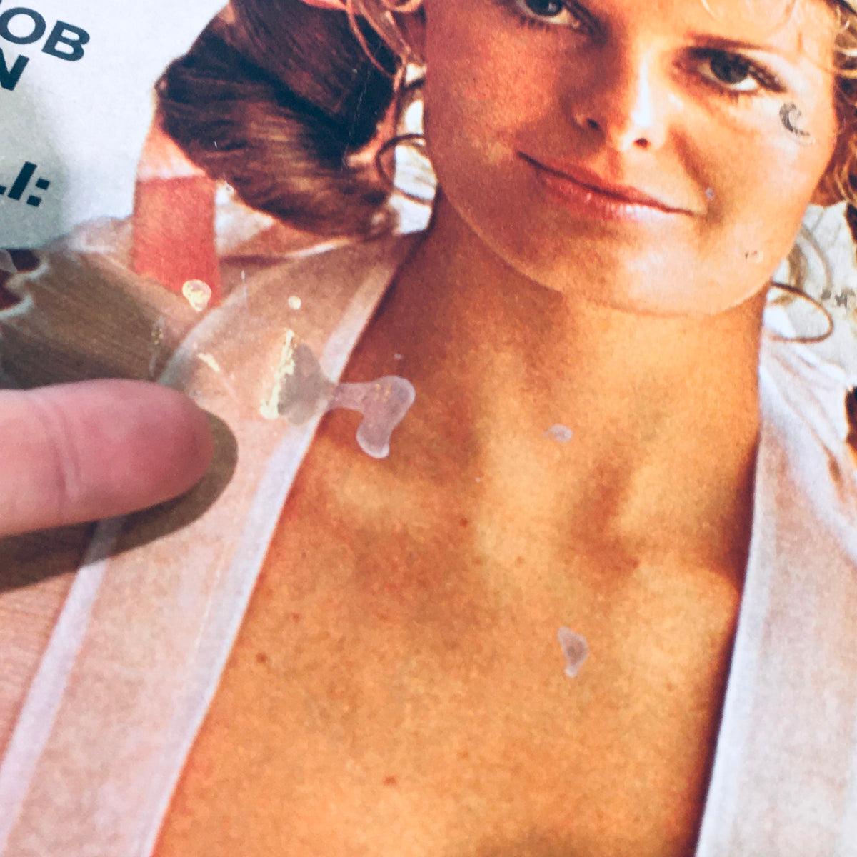 Close-up of a vintage magazine cover from Look Magazine March 9, 1971 featuring a female model with soft curls and a light dress, showcasing wear and tear.