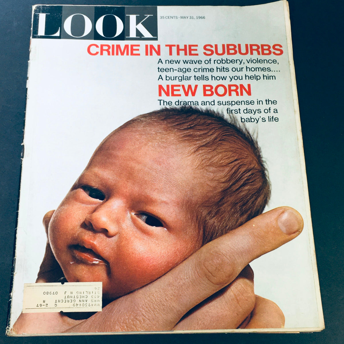 Cover of VTG Look Magazine dated May 31, 1966, featuring the headline "Crime in the Suburbs" alongside an image of a newborn baby, showcasing themes of societal challenges and the joy of new life.