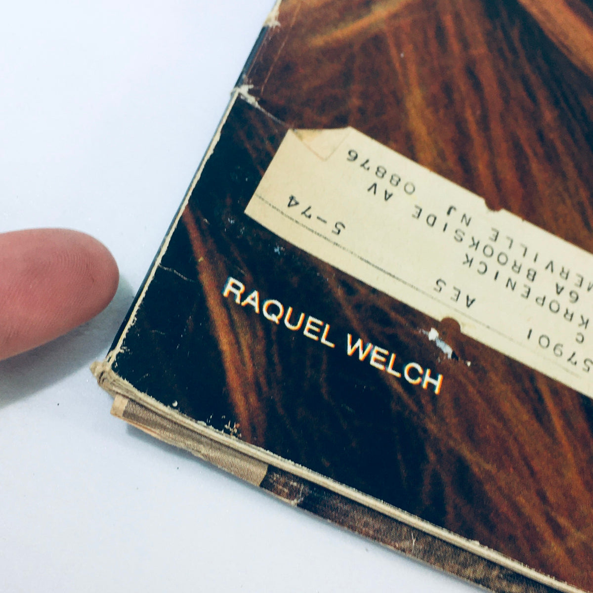 Close-up of the spine of Look Magazine, March 24, 1970, highlighting Raquel Welch's name, showcasing the magazine's vintage characteristics.