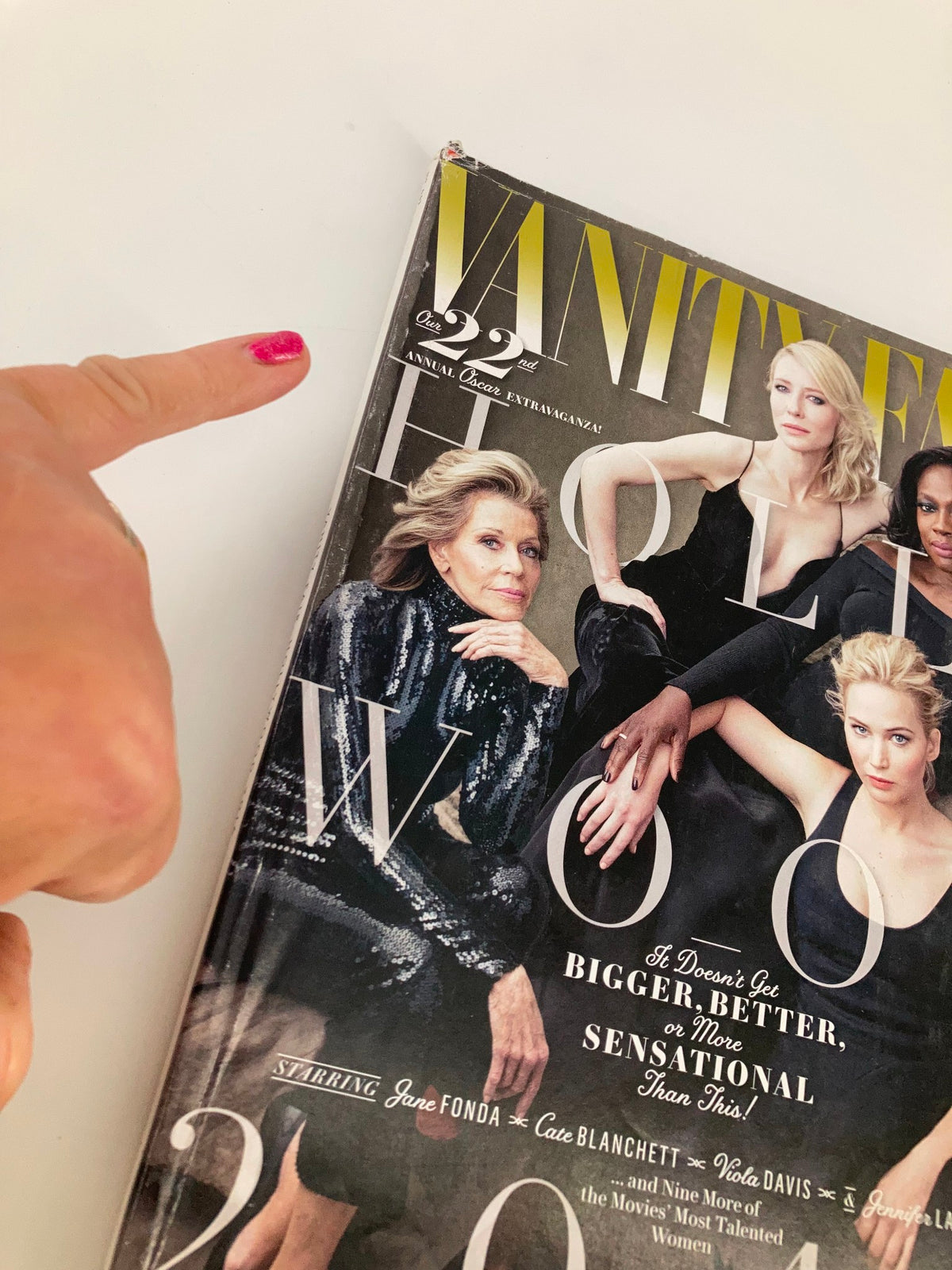 Close-up of the 2016 Vanity Fair Magazine featuring Jane Fonda on the cover, showcasing Hollywood stars, with a focus on the magazine's title and the actress pointing at it.