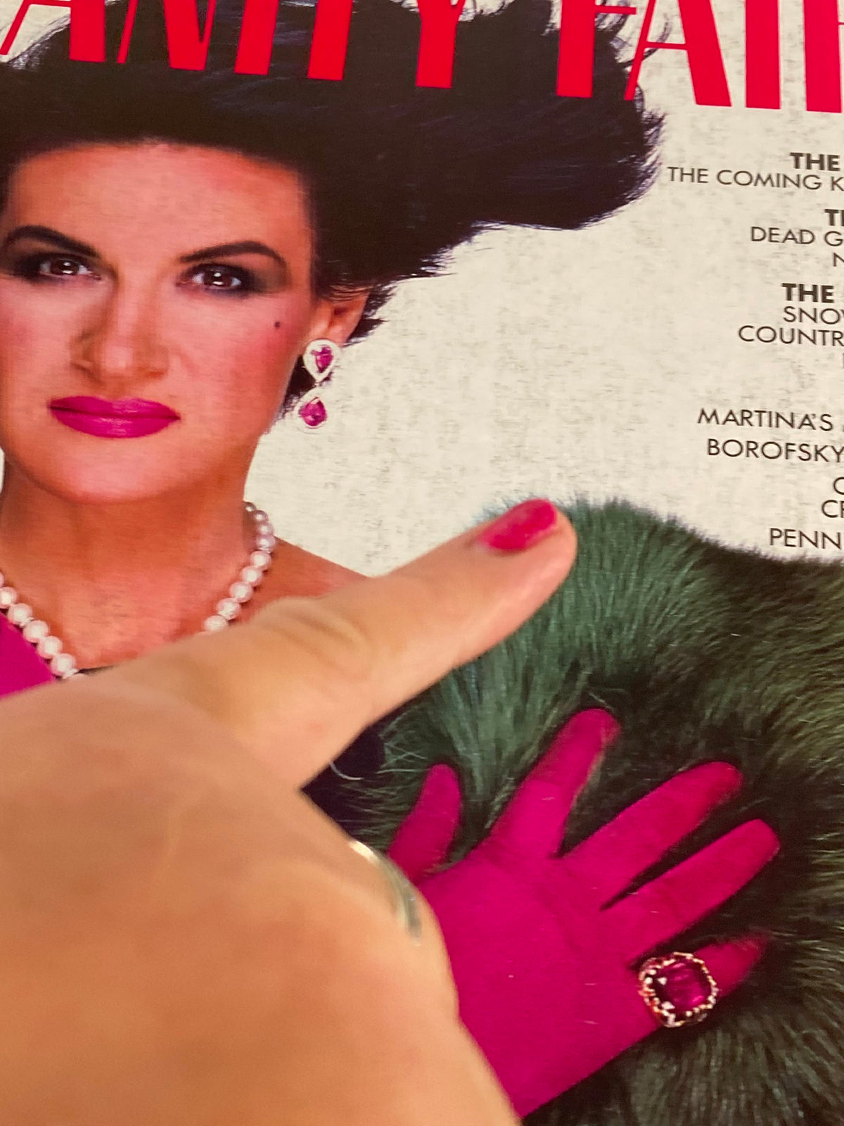 Close-up of the cover of VTG Vanity Fair Magazine September 1984, highlighting a glamorous model adorned with luxurious accessories, featuring bold colors and styles emblematic of the era.