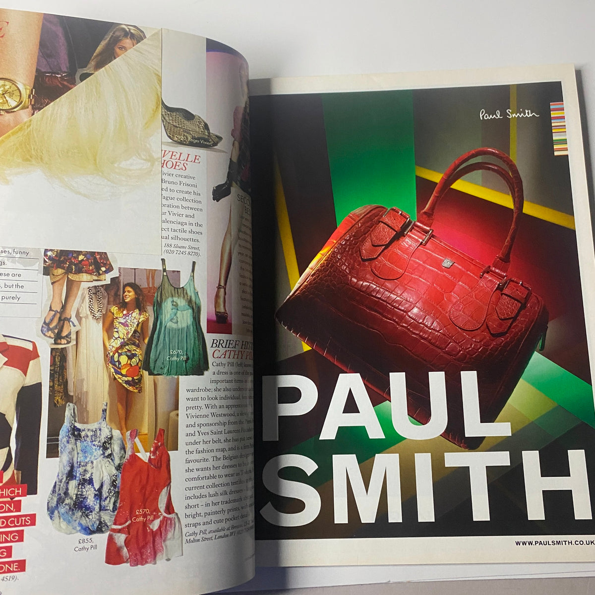 Harper's Bazaar British Magazine April 2009 features a vibrant advertisement for Paul Smith showcasing a striking red handbag alongside colorful fashion looks.