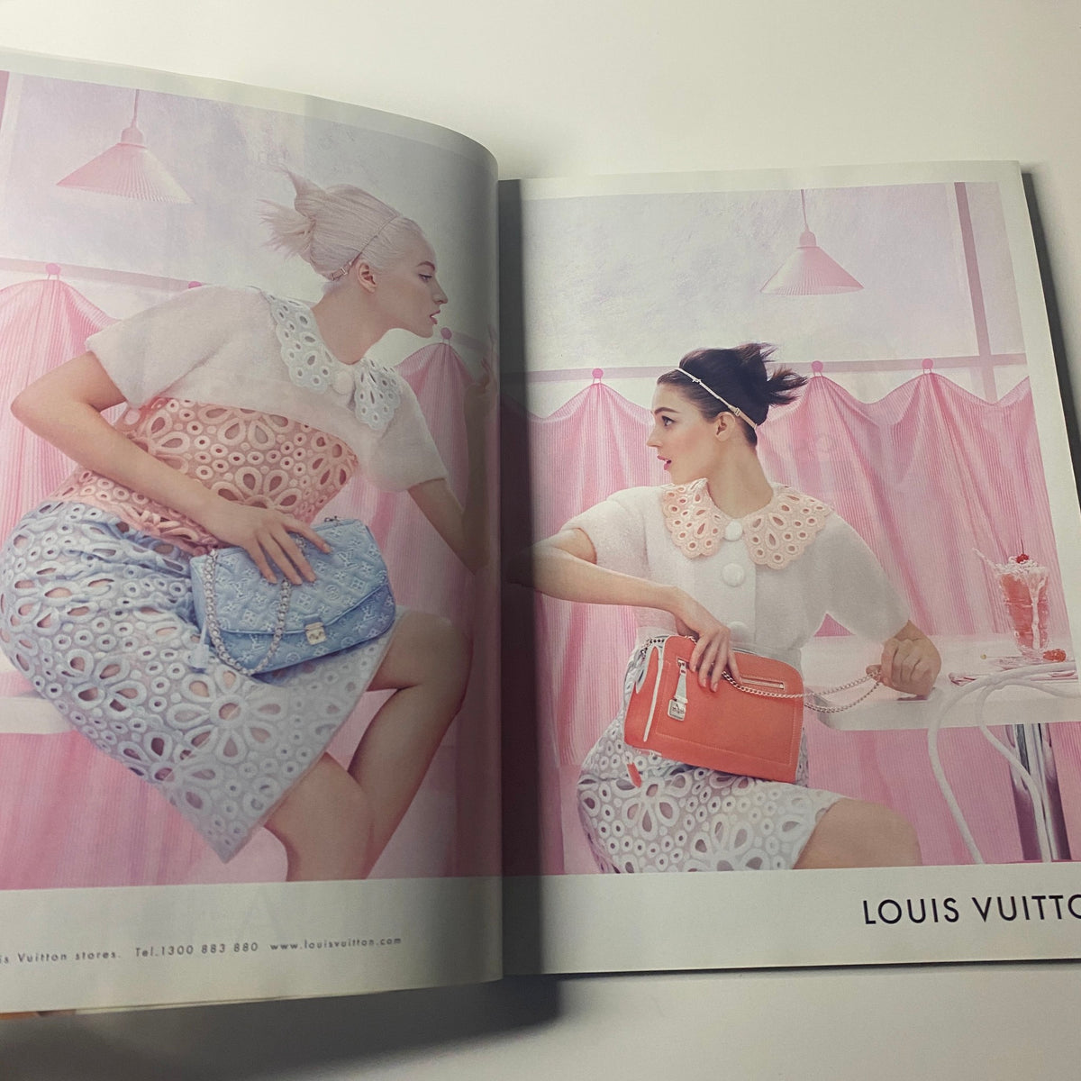 Harper's Bazaar Australia Magazine May 2012 featuring two models in Louis Vuitton fashion, showcasing high-fashion looks in a colorful and artistic presentation.