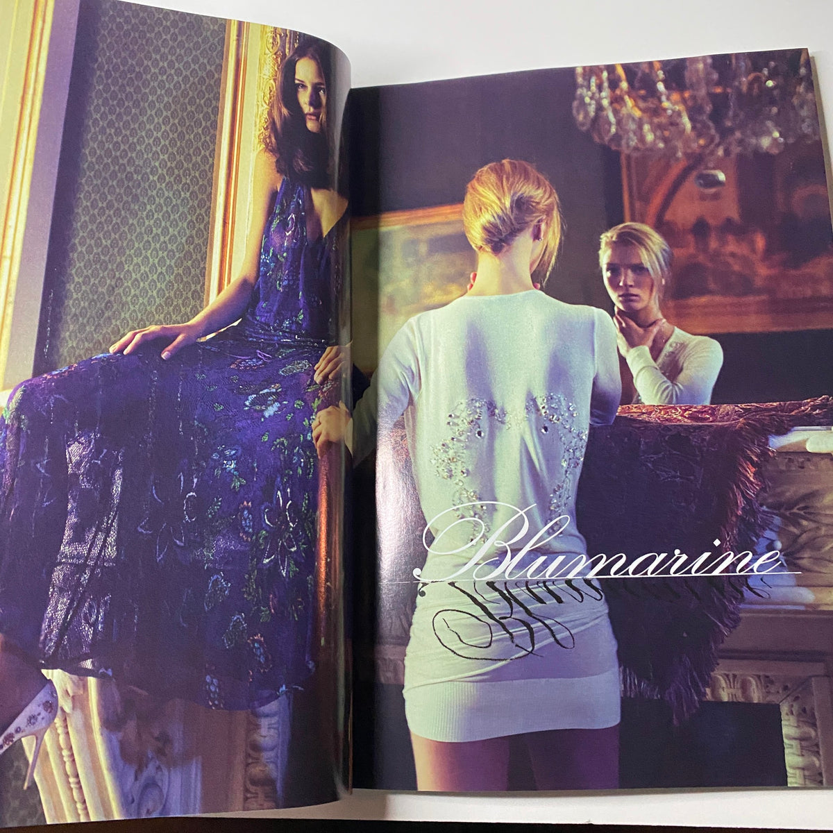 Harper's Bazaar Magazine February 2006 showing a luxurious advertisement for Blumarine, featuring an elegant model in a stunning gown, set in an opulent interior.
