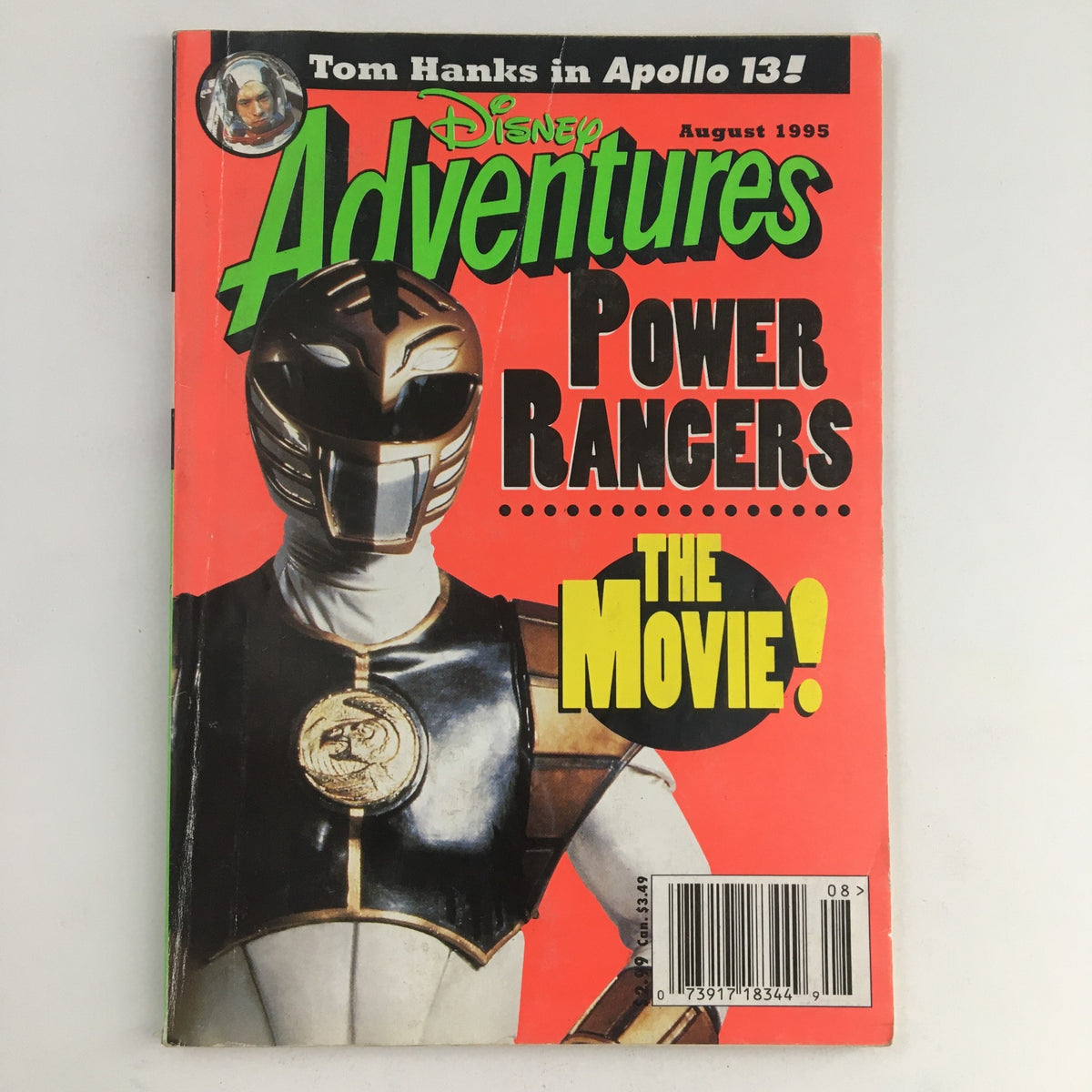 Cover of Disney Adventures Magazine from August 1995 featuring the Power Rangers movie. The bold colors and graphics highlight the memorabilia quality, showcasing iconic characters alongside a reference to Tom Hanks.