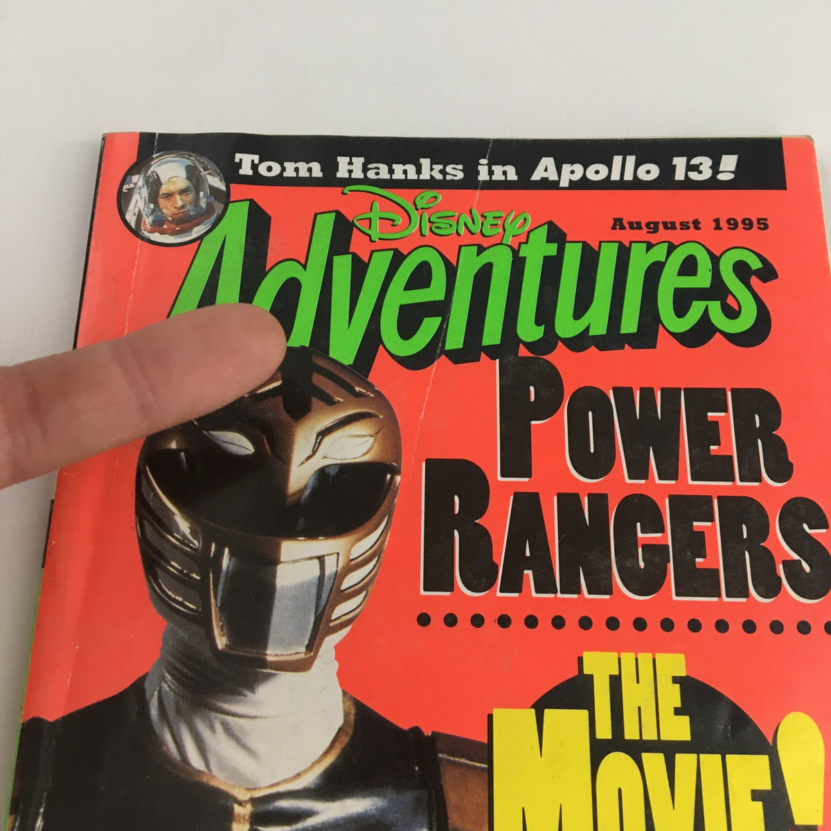 Close-up of Disney Adventures Magazine August 1995 cover, focusing on the Power Rangers depiction and the note about Tom Hanks in Apollo 13. The vibrant layout captures the essence of 90s pop culture.