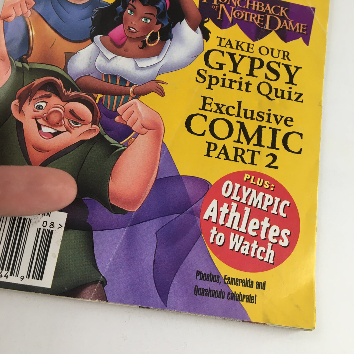 Close-up view of Disney Adventures Magazine August 1996 cover displaying The Hunchback of Notre Dame. Prominent characters Quasimodo, Esmeralda, and Phoebus are featured along with promotional text for content inside.