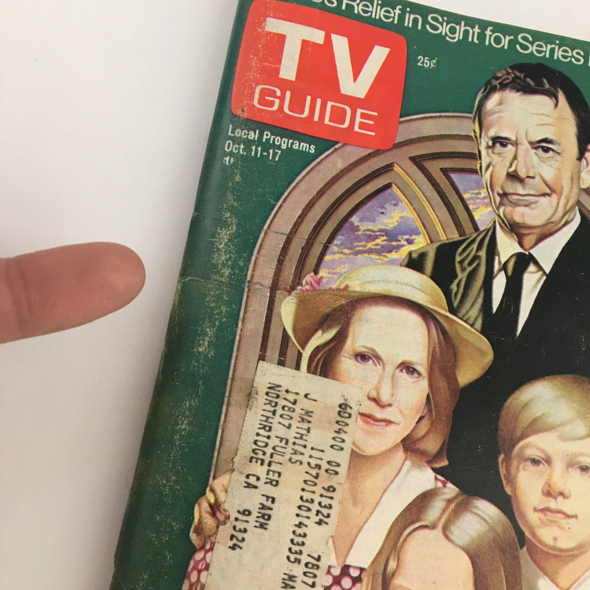 Close-up view of the cover of TV Guide Magazine from October 11, 1975, with details of Glenn Ford and Lance Kerwin, highlighting a vintage magazine collectible.