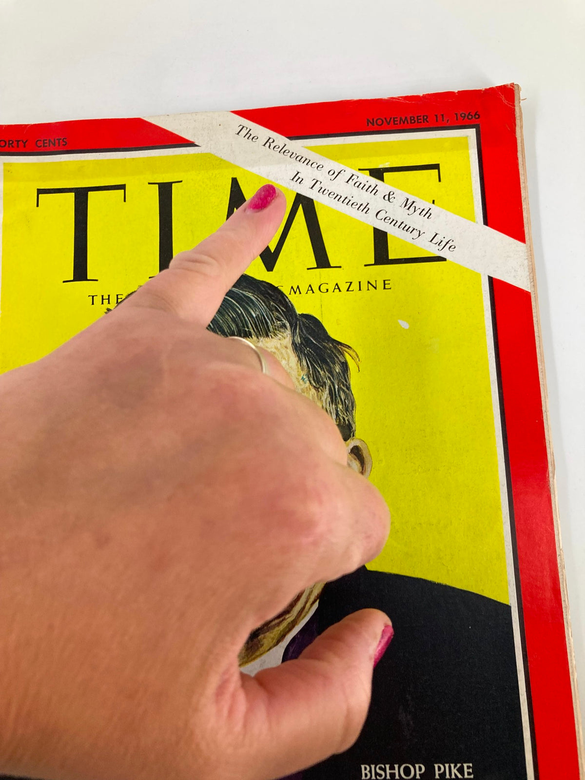 Close-up view of the Time Magazine cover from November 11, 1966, focusing on the headline discussing the relevance of faith and myth in 20th-century life, featuring Bishop James Pike.