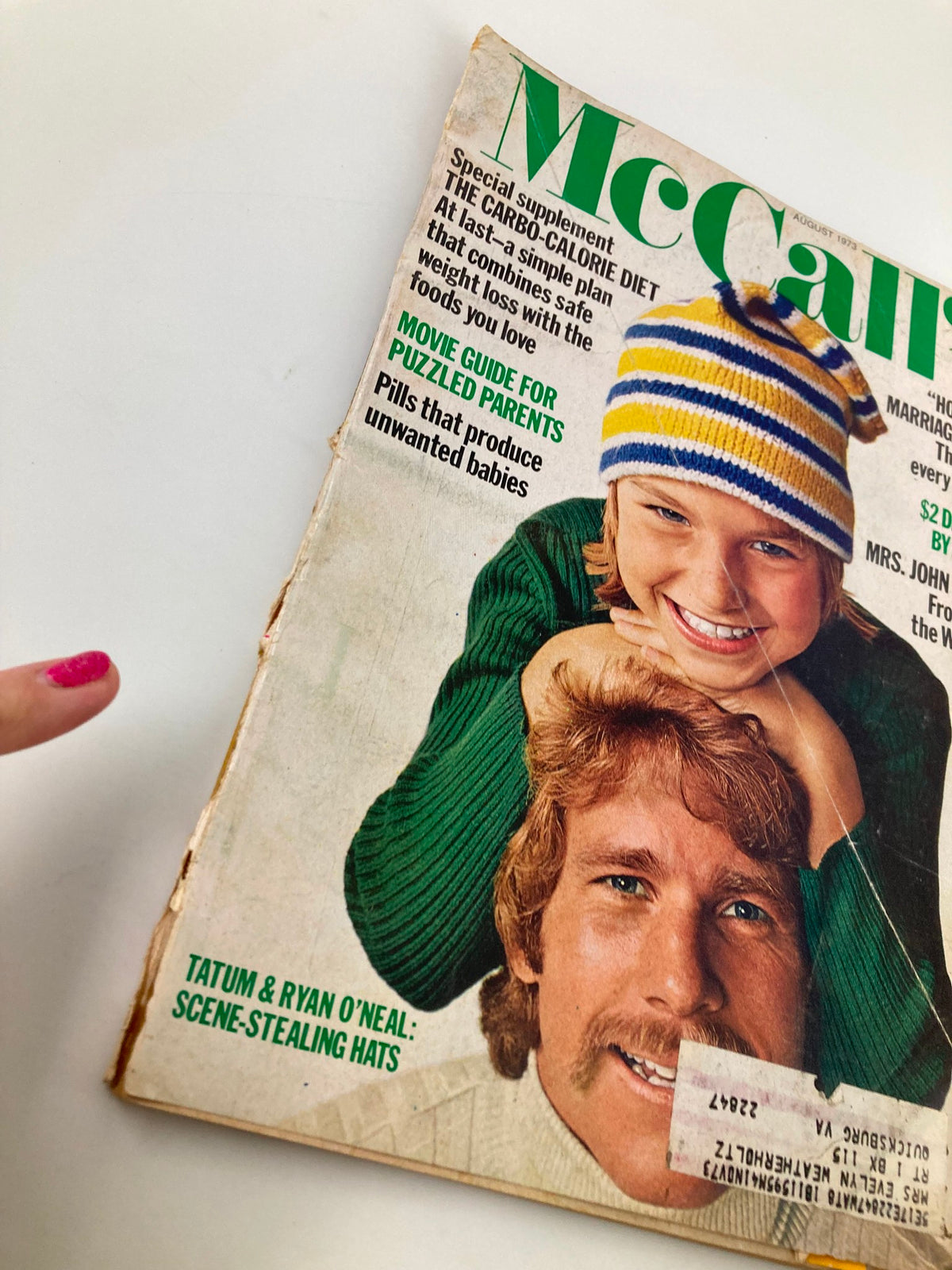 Close-up of the cover of VTG McCall's Magazine August 1973 highlighting Tatum and Ryan O'Neal's scene-stealing hats.