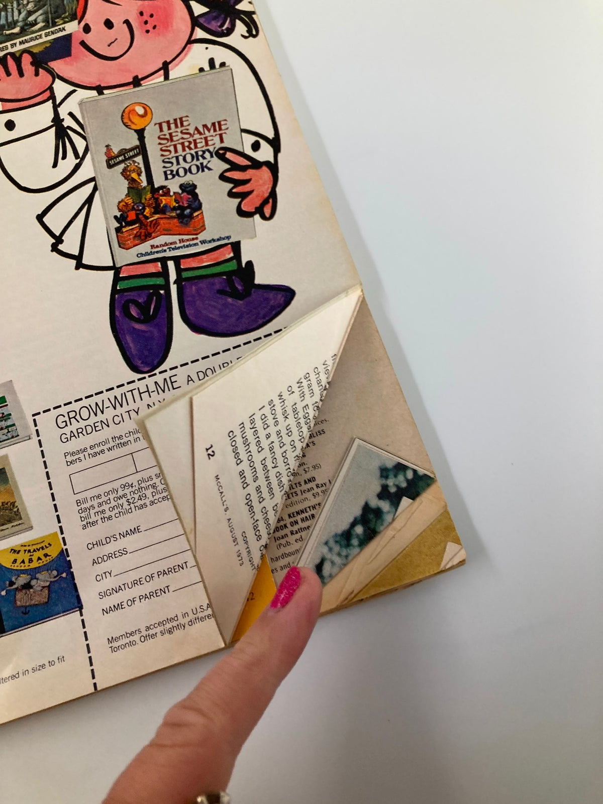 Inside page of VTG McCall's Magazine August 1973 showing ads and sections related to children's books and parenting tips.