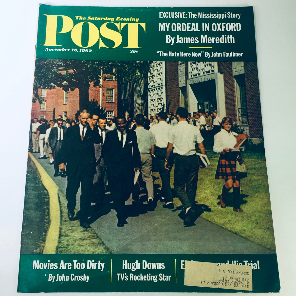 Cover of The Saturday Evening Post from November 10, 1962, featuring 'Hugh Downs TV's Rocketing Star.' The image shows a group of students walking on campus, highlighting a significant historical moment, with topics including movies and civil rights on the cover.