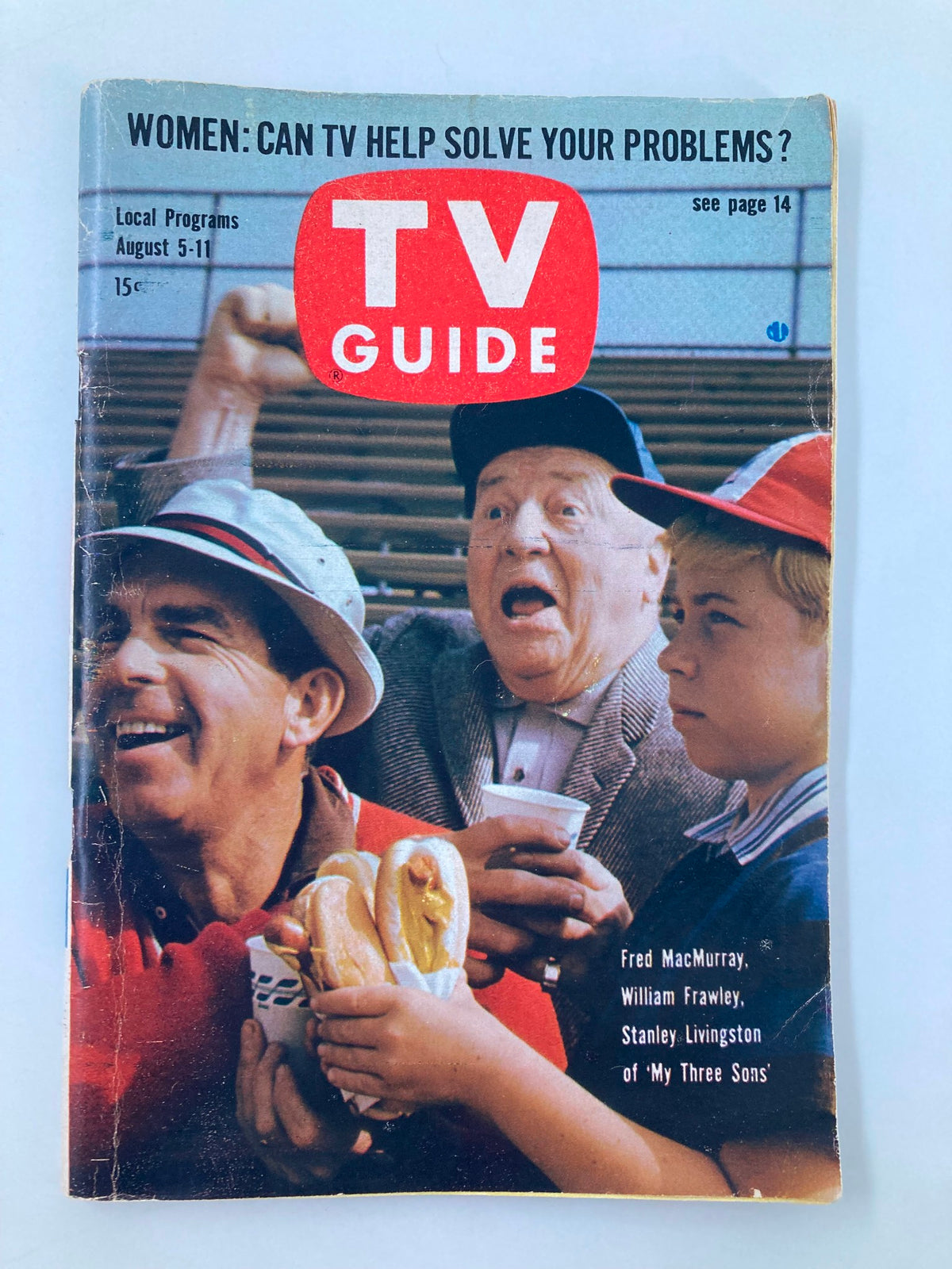 Cover of the vintage TV Guide Magazine from August 5, 1961, featuring Fred MacMurray and other stars from 'My Three Sons'. The cover showcases an engaging headline asking if TV can solve problems, capturing the essence of 1960s entertainment.