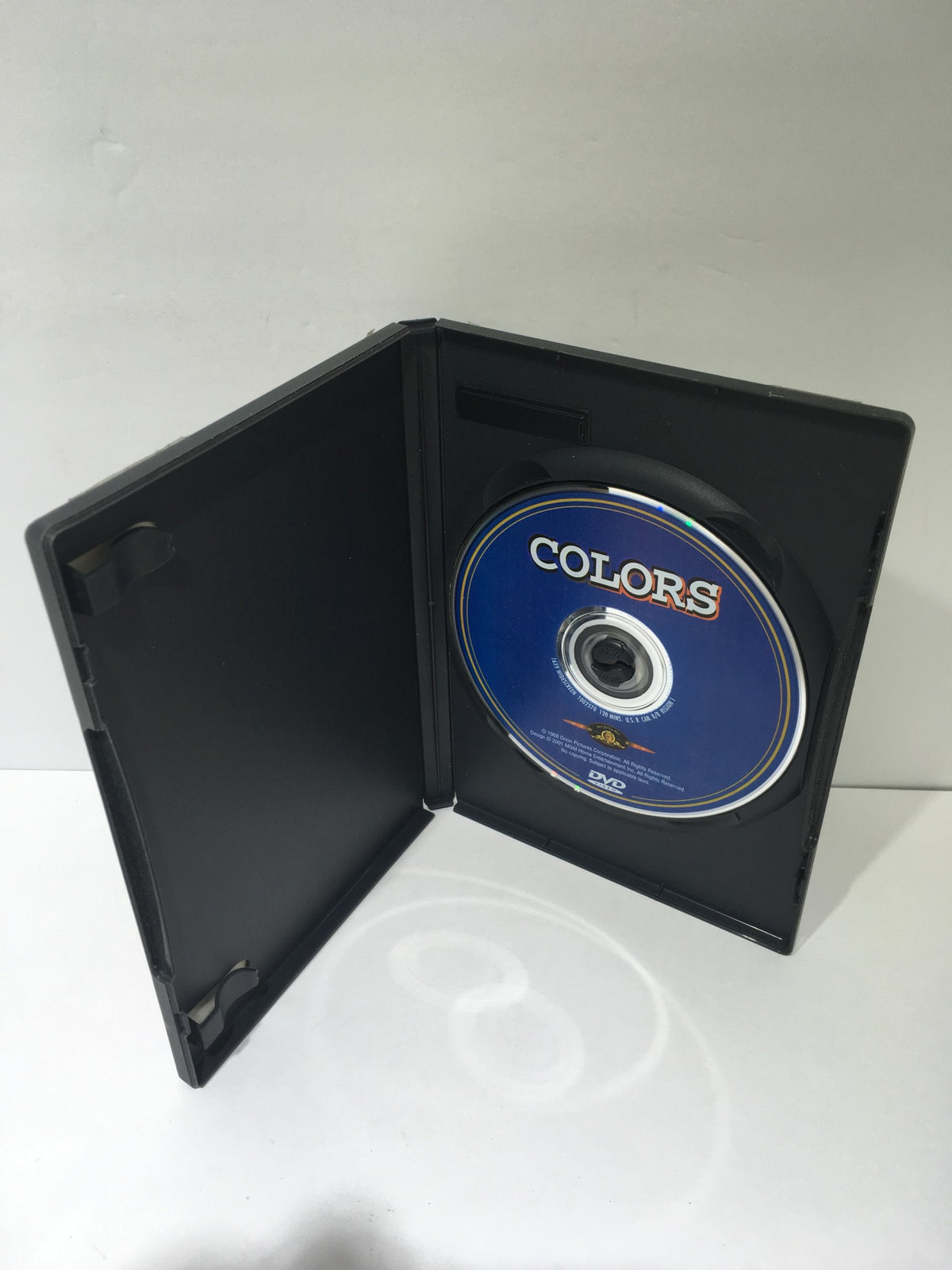 Open Colors DVD case showing the disc with the title 'Colors' visible inside.