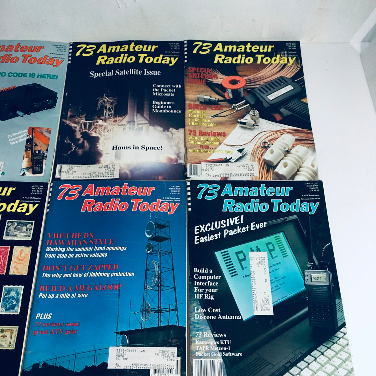 Lot of 12 Complete January to December 1991 73 Amateur Radio Volume 1 to 12. Focused layout displaying covers from the magazine including satellite and antenna building articles.