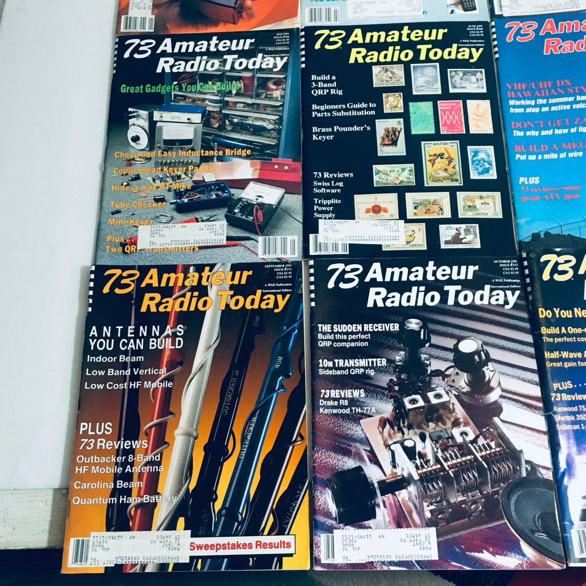Lot of 12 Complete January to December 1991 73 Amateur Radio Volume 1 to 12. Arrangement of magazine covers highlighting various topics in amateur radio and electronics.