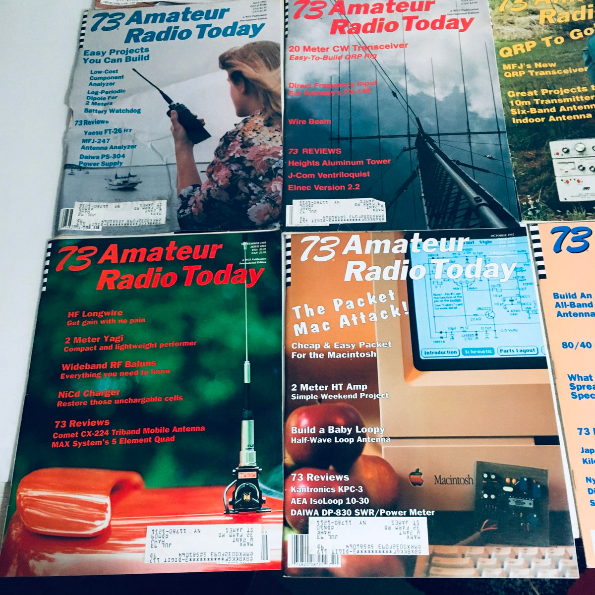 Lot of 12 Complete January to December 1992 73 Amateur Radio Volume 1 to 12, showcasing magazine articles about amateur radio projects, including a woman using a radio and various antennas.