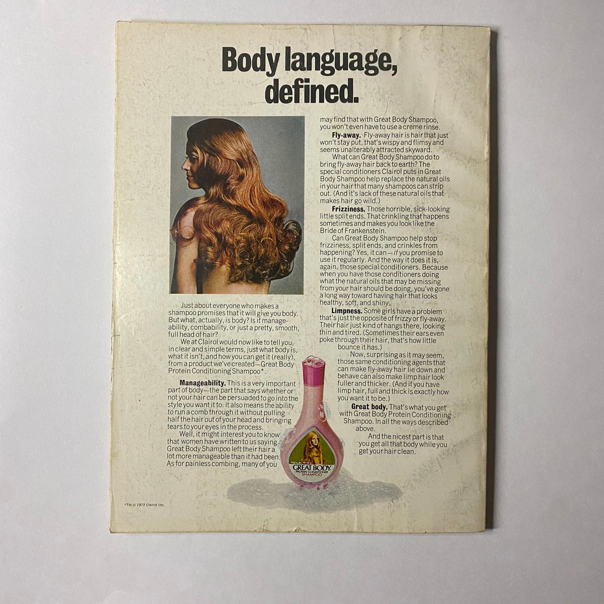 Back cover of the July 1972 Glamour Magazine featuring a model with long hair showcasing an ad for Body Shampoo, emphasizing beauty and hair care, in the context of the magazine's fashion and lifestyle themes.