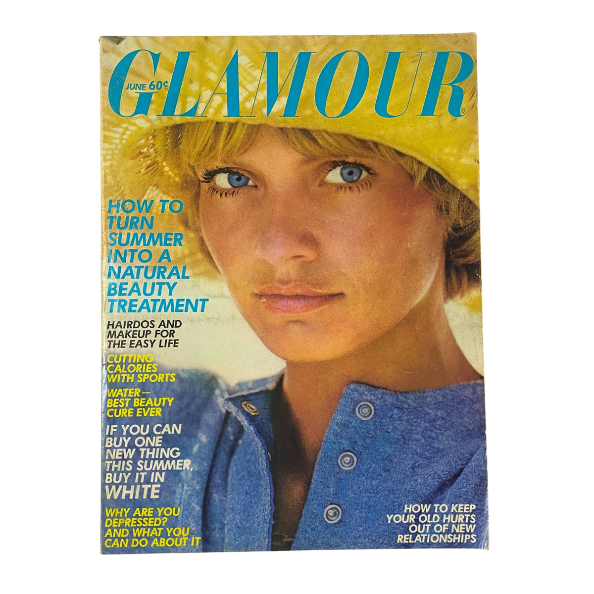 Glamour Magazine June 1972 Cover Look Photographed by Mike Reinhardt featuring a woman with a yellow hat and natural beauty theme, celebrating summer style.