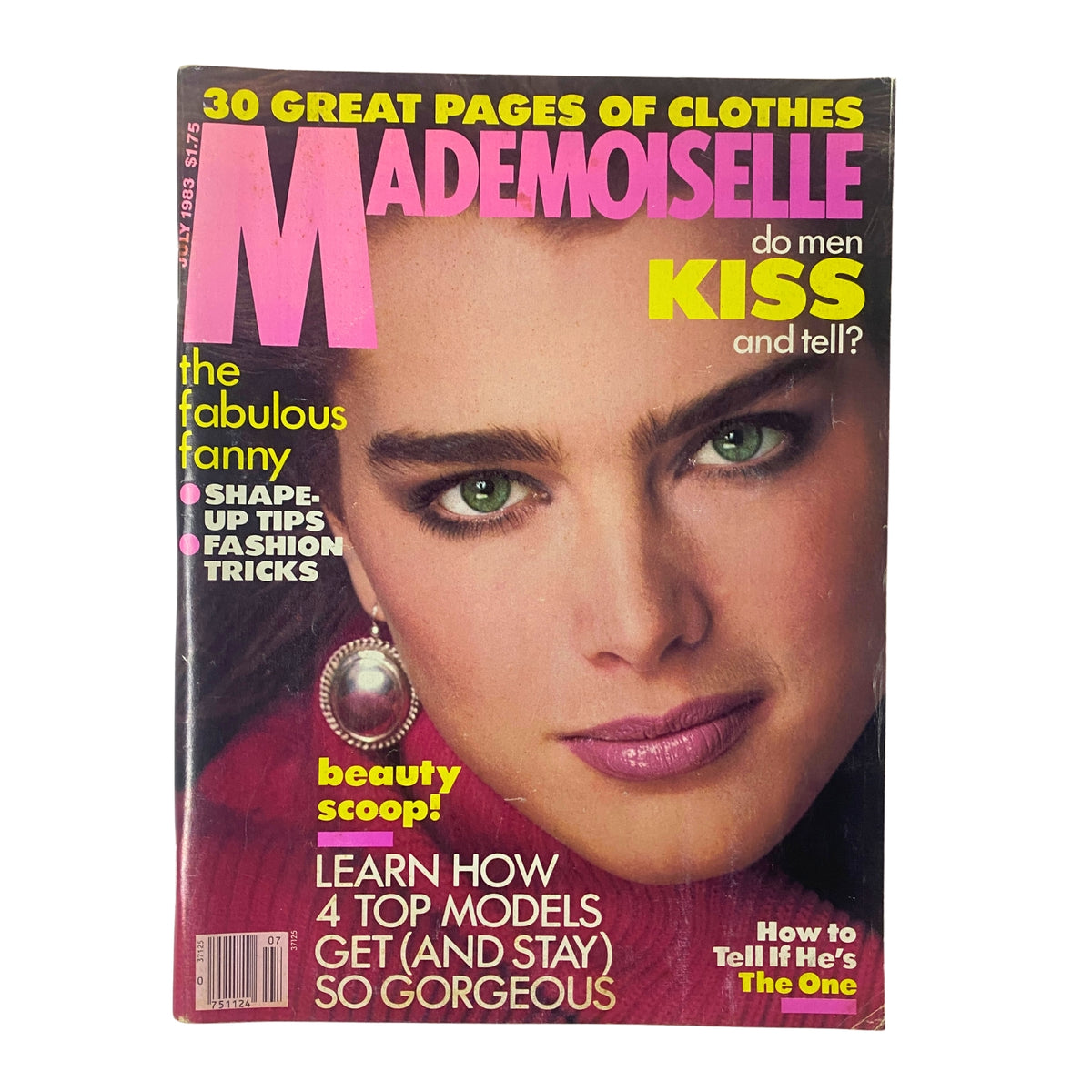 Mademoiselle Magazine July 1983 cover featuring model Brooke Shields with striking green eyes, promoting articles on fashion and beauty, highlighting topics like summer skincare and style tips.